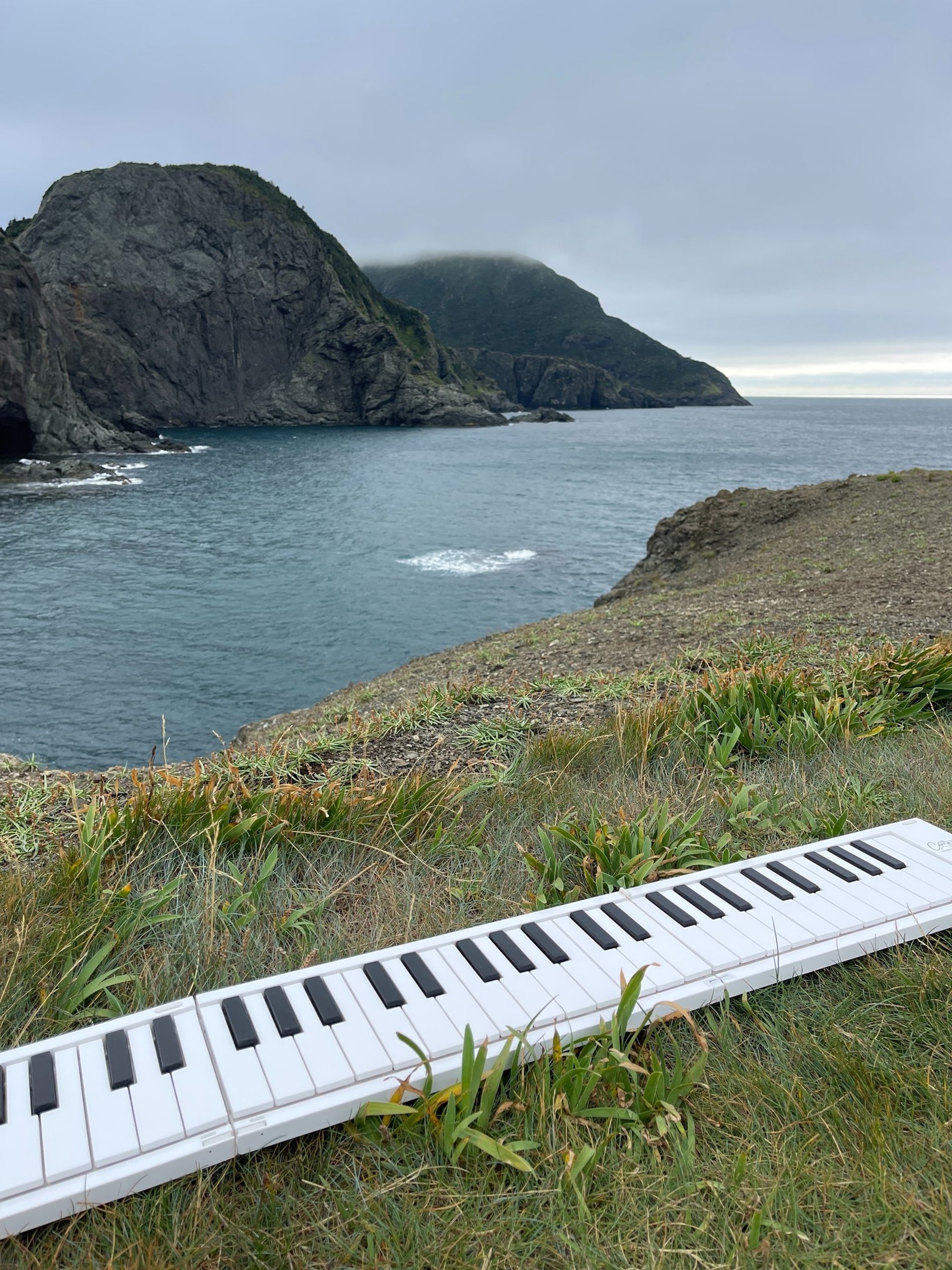 image of keyboard on edge of cliff for online piano courses by Jen Smith Lanthier