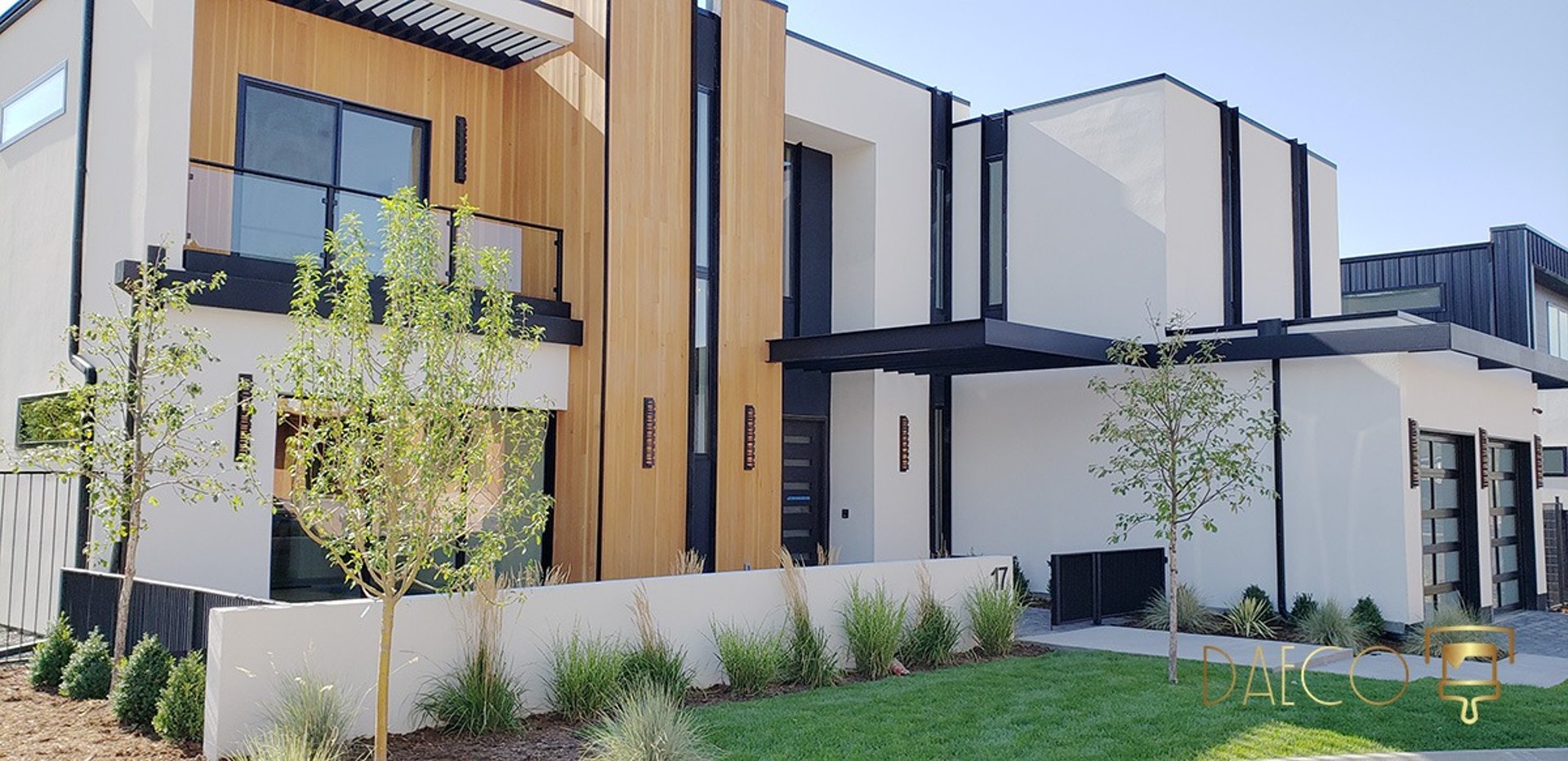 an abstract photo of a curved building with a blue sky in the background