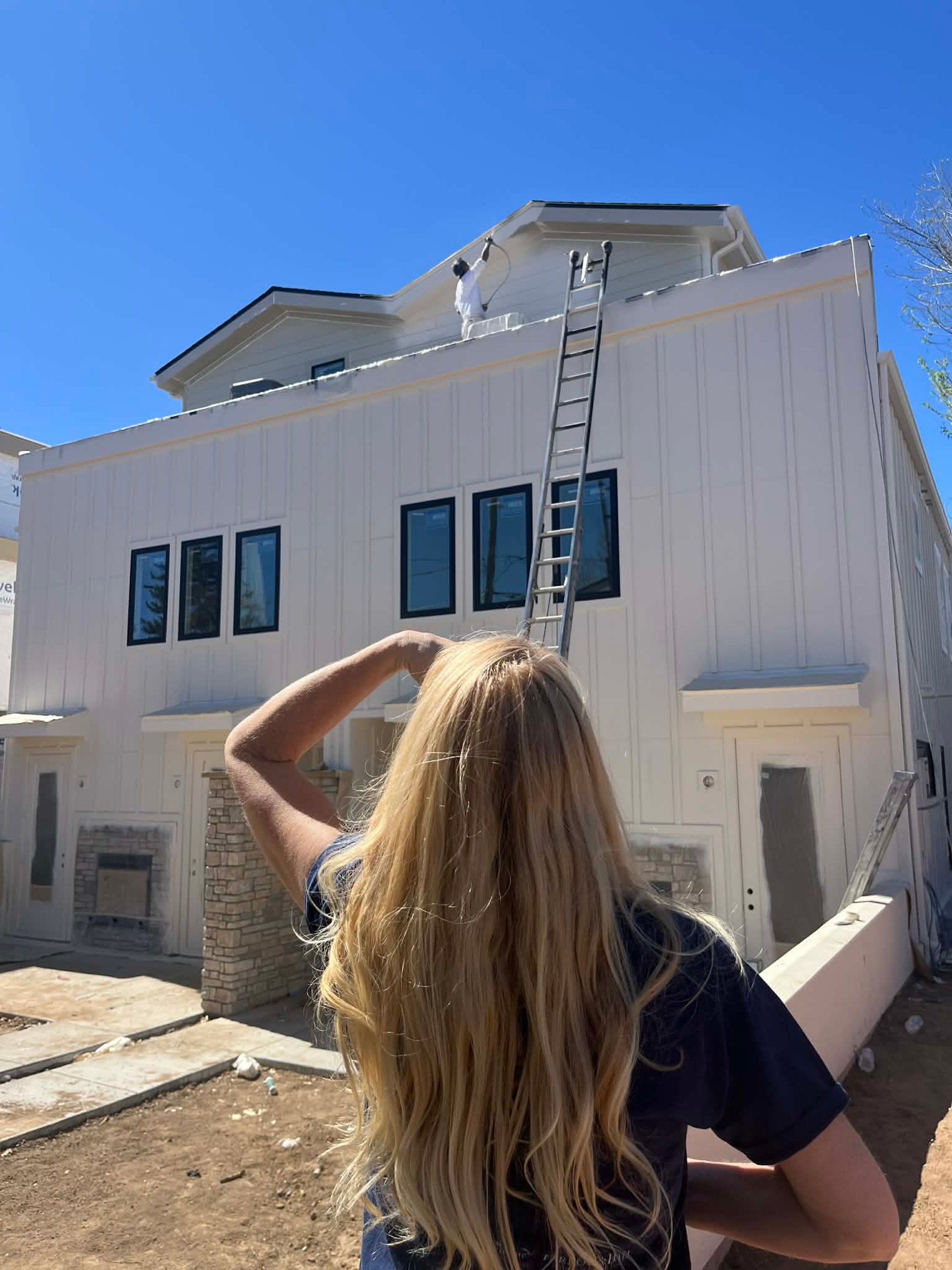 an abstract photo of a curved building with a blue sky in the background