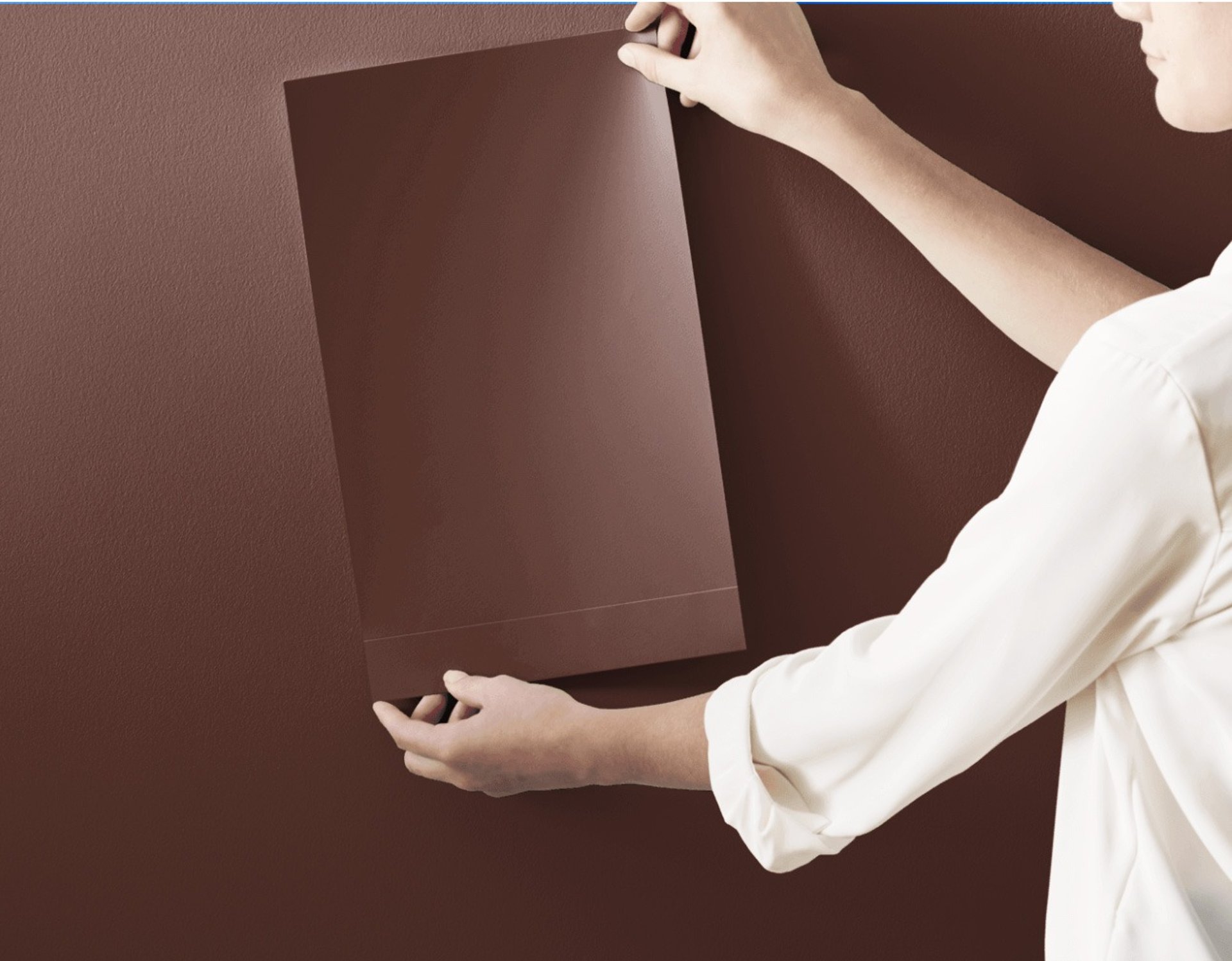 an abstract photo of a curved building with a blue sky in the background