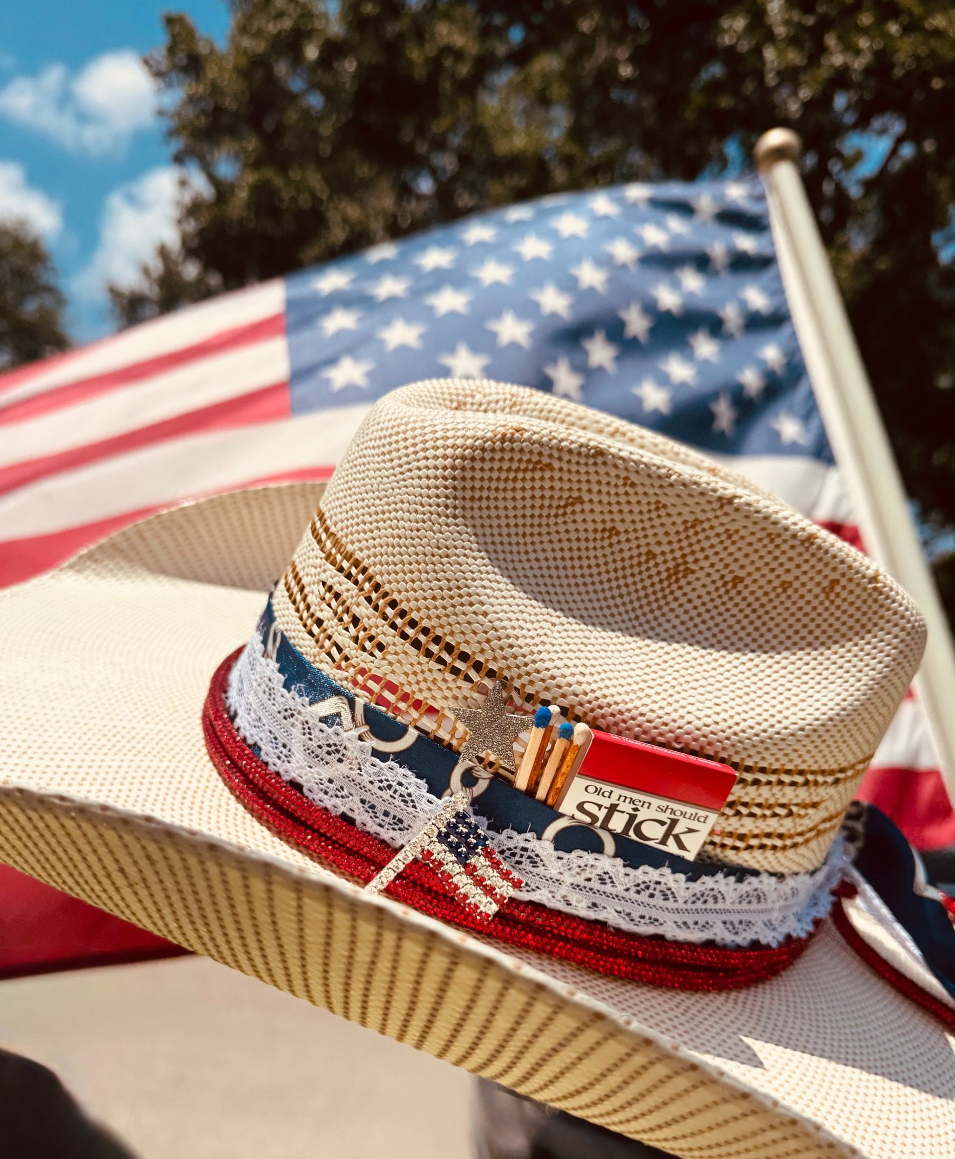 Cowboy hats are hanging in a neat vertical row.