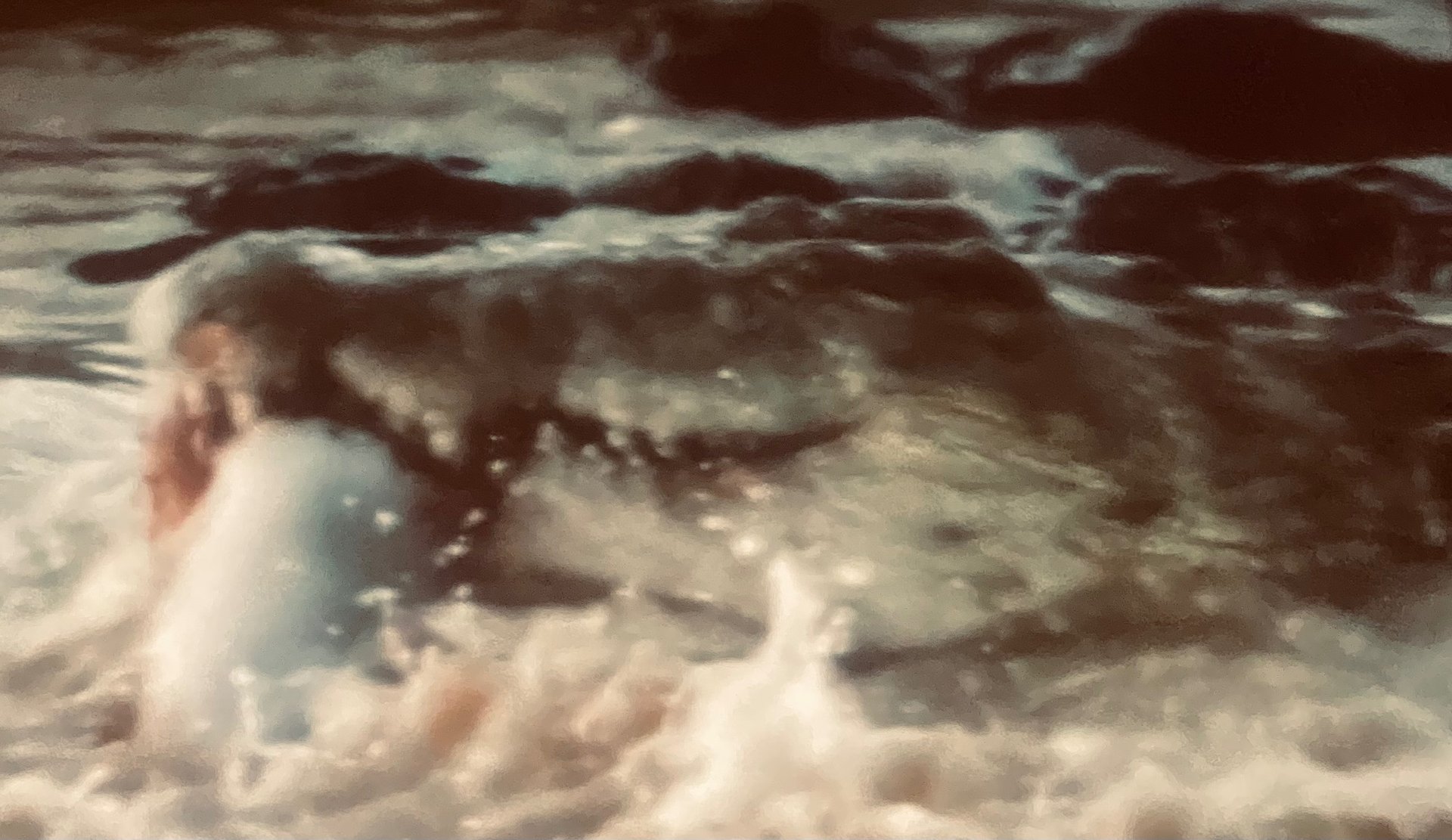 an abstract photo of a curved building with a blue sky in the background