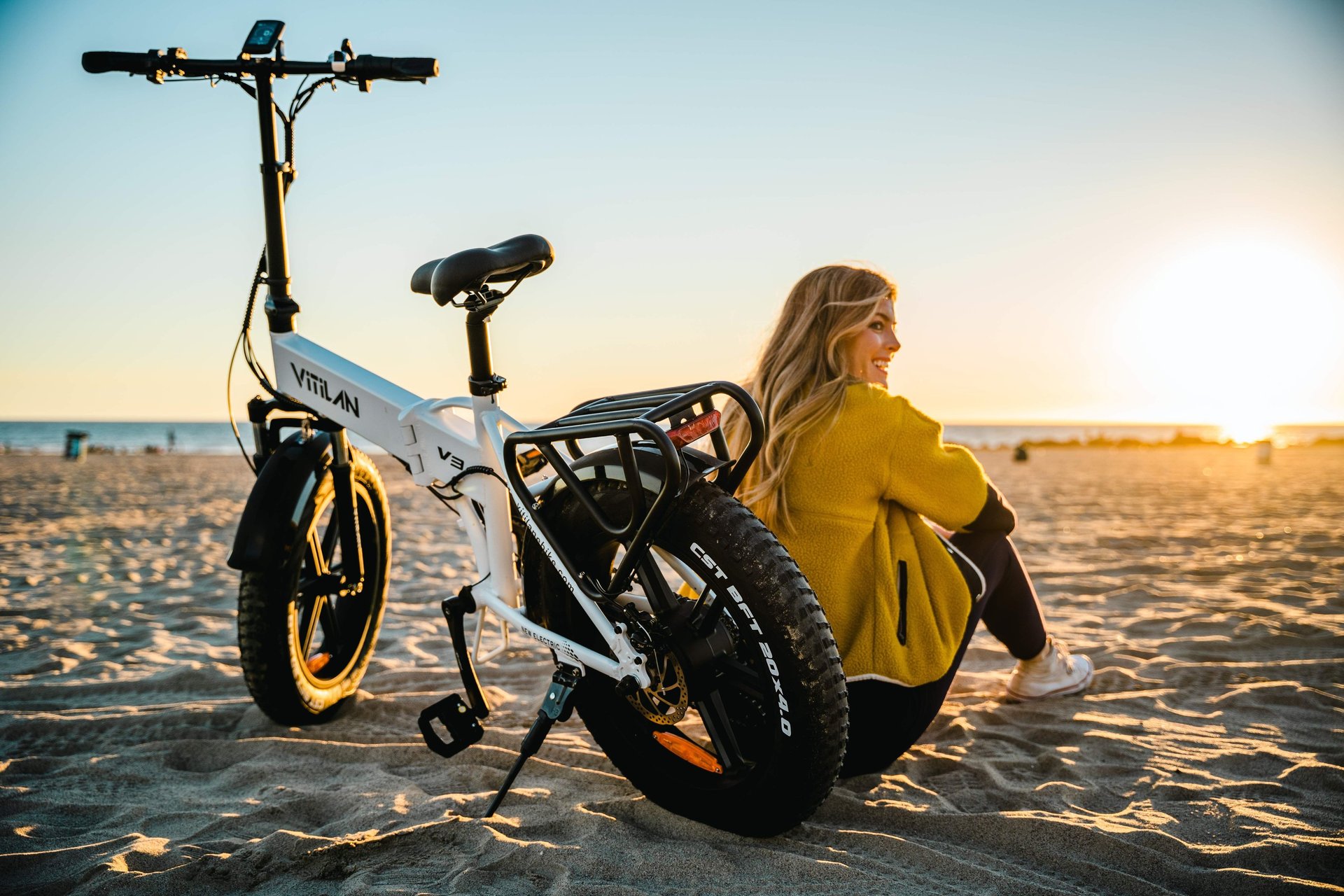 a man and a woman standing next to their bikes
