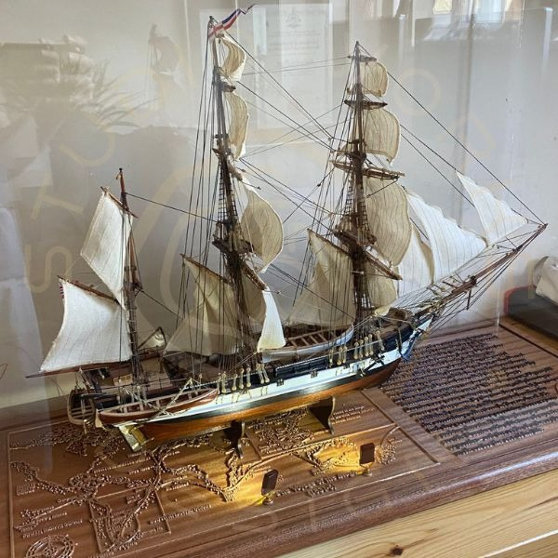 Display base for a model ship display showing integrated lighting