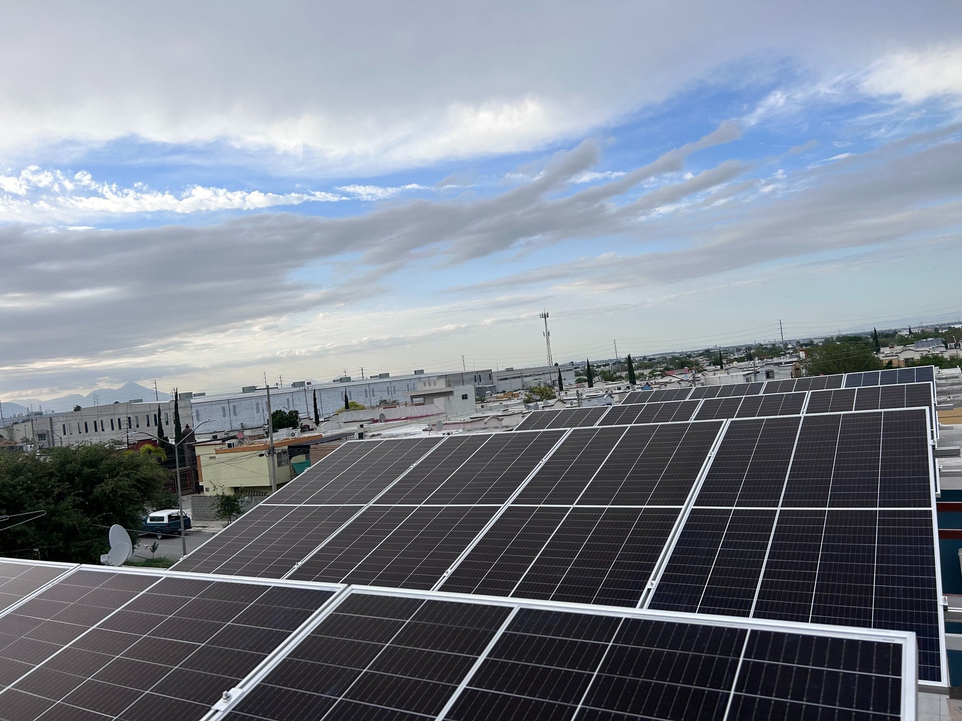 an abstract photo of a curved building with a blue sky in the background