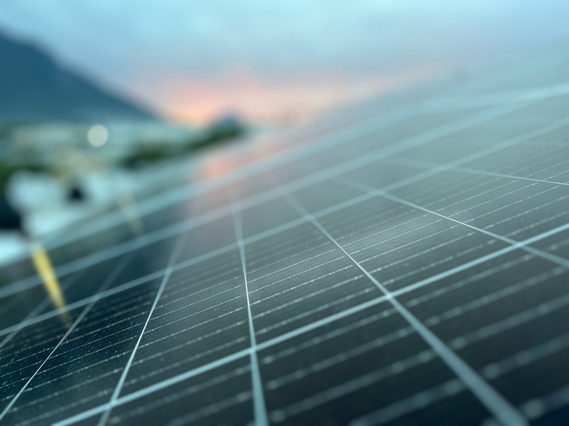 an abstract photo of a curved building with a blue sky in the background