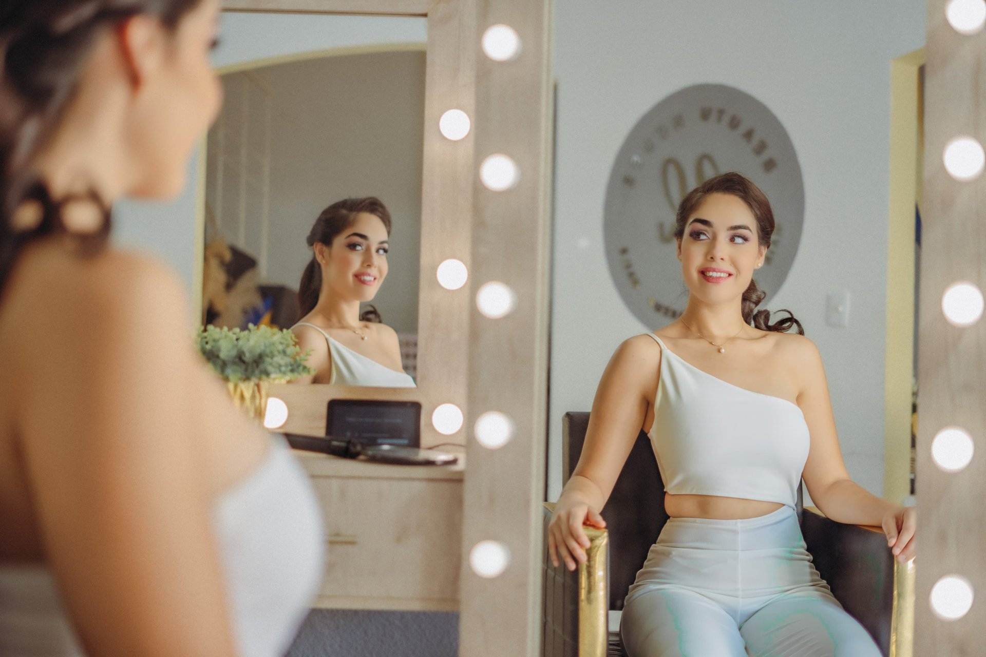 A woman holding a bouquet of white flowers