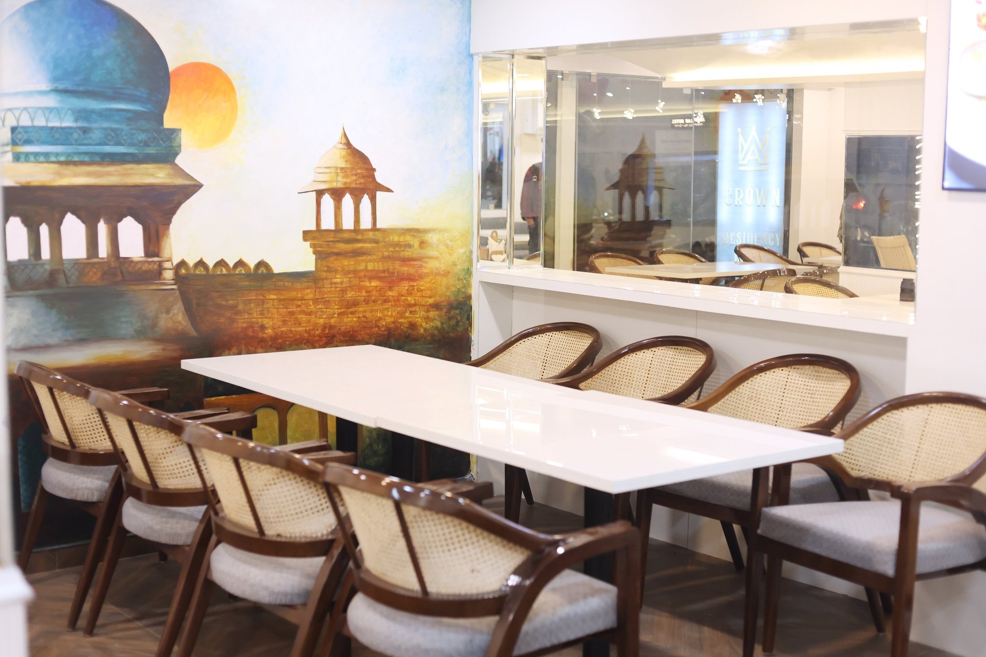 low-angle photo of Hotel lighted signage on top of brown building during nighttime