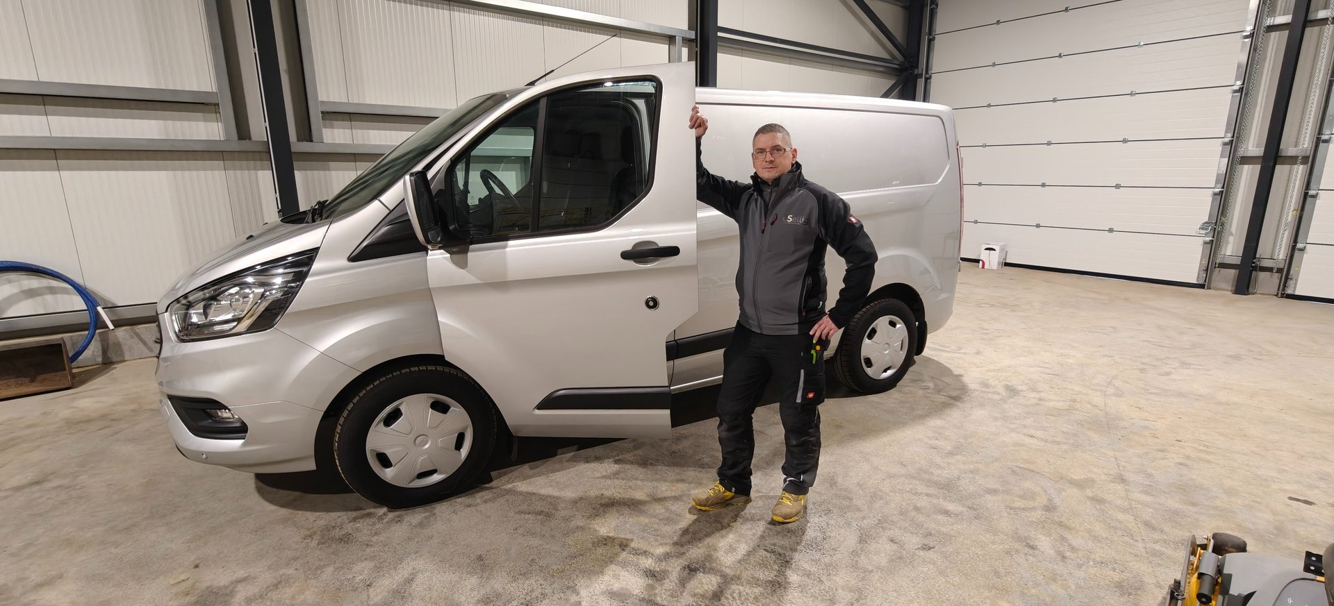 brown and white concrete building near green trees during daytime