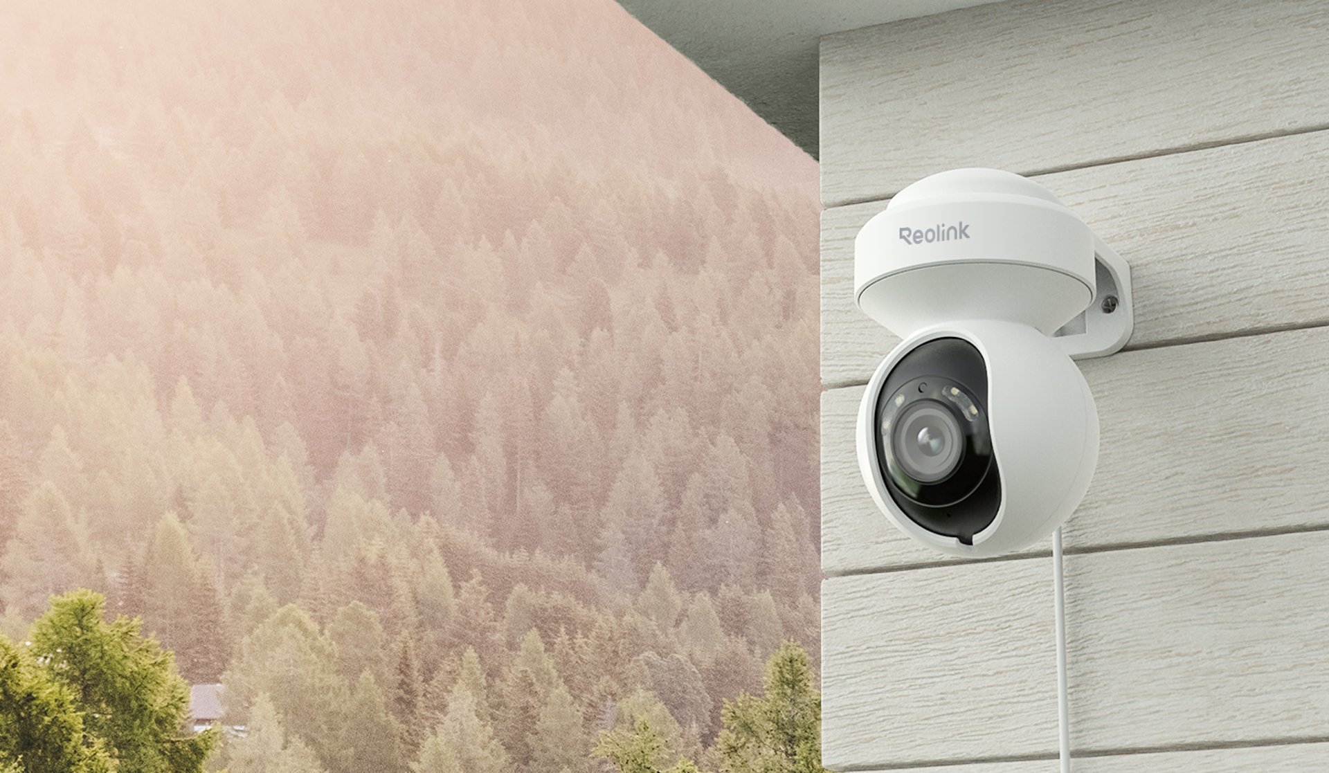 three white CCTV cameras mounted on wall