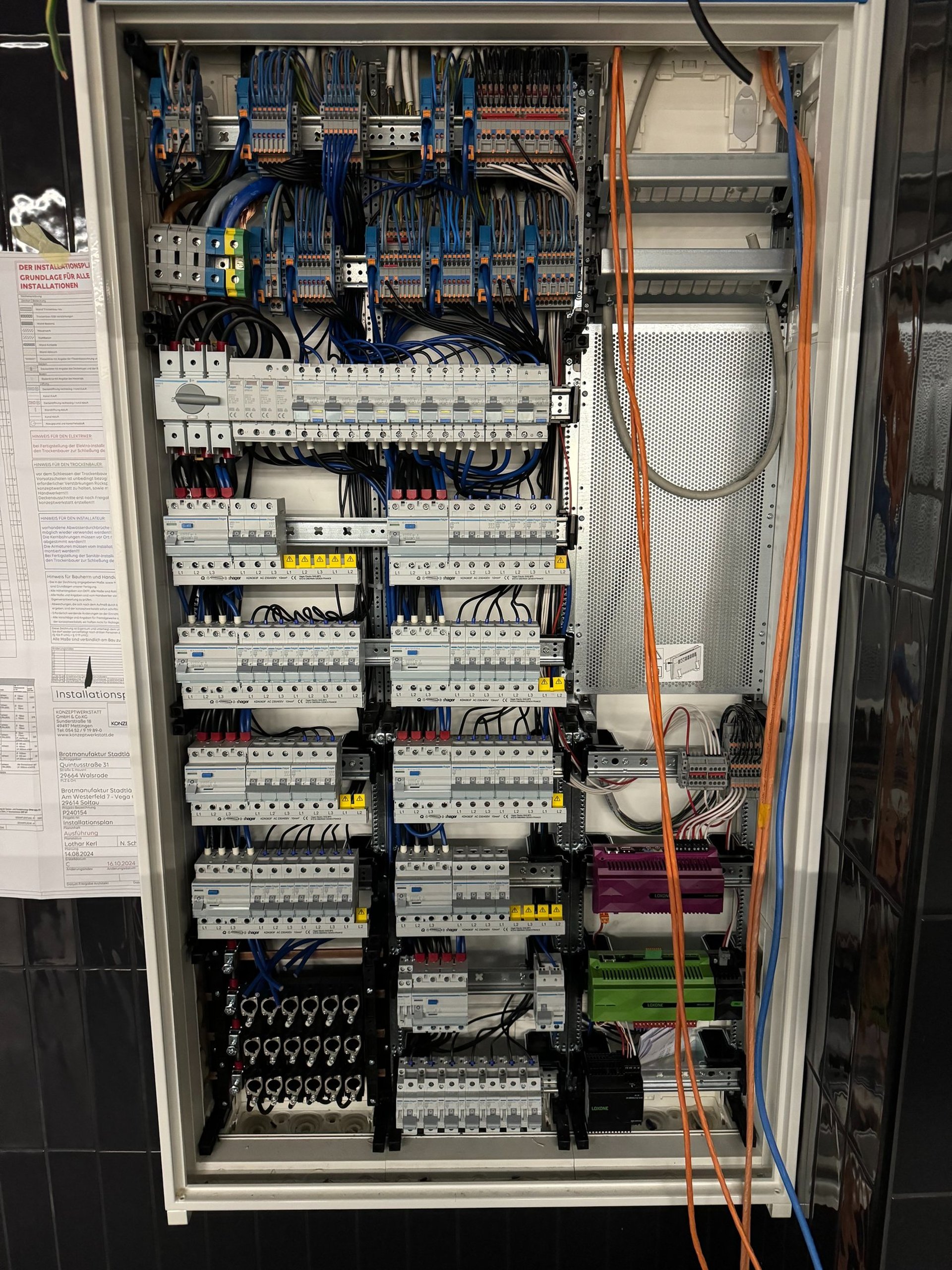 an abstract photo of a curved building with a blue sky in the background
