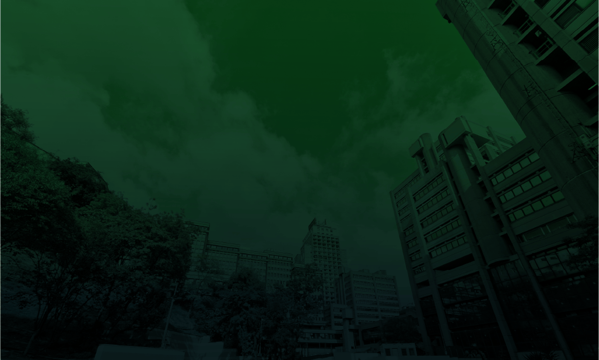 an abstract photo of a curved building with a blue sky in the background