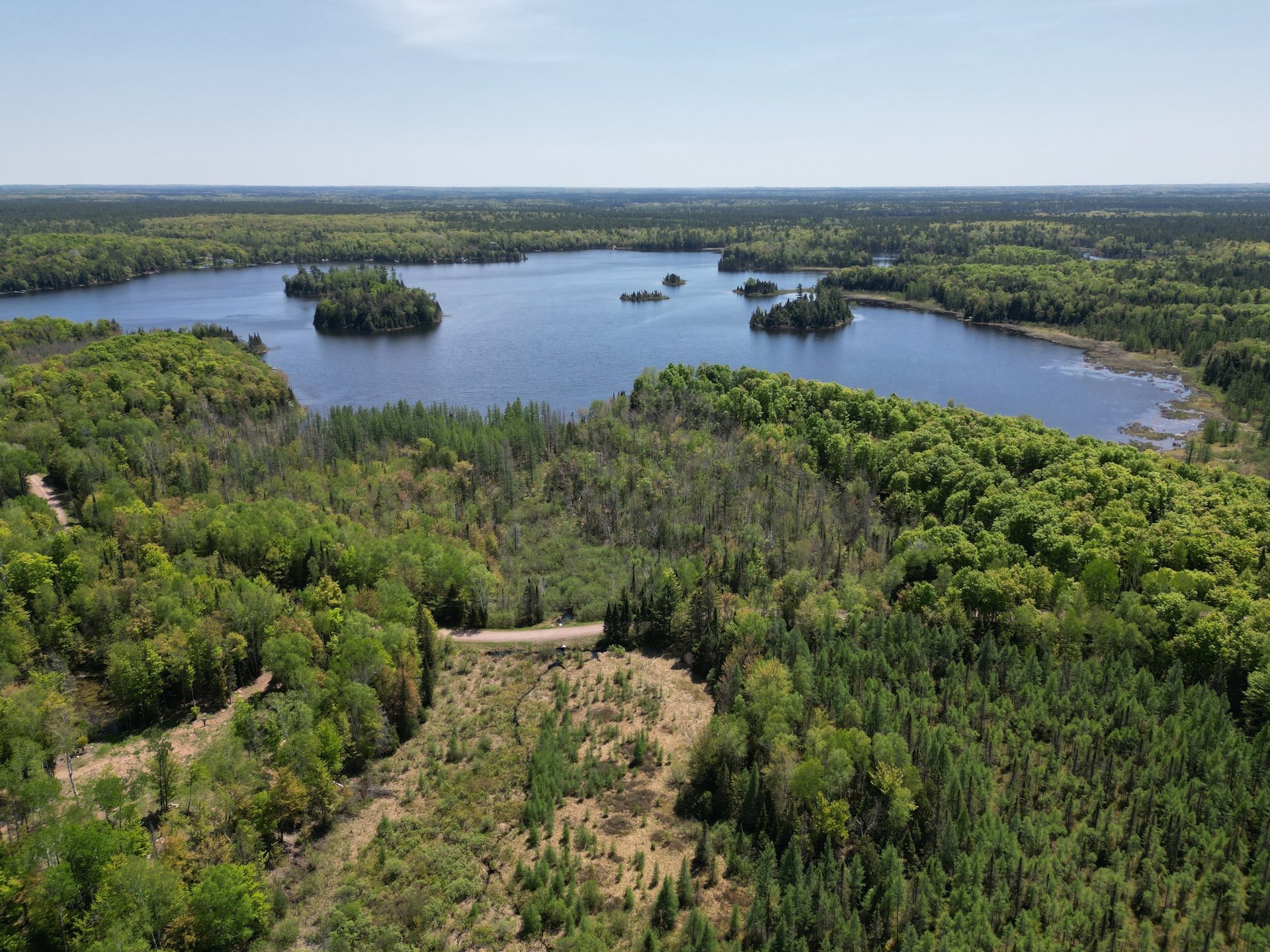 an abstract photo of a curved building with a blue sky in the background