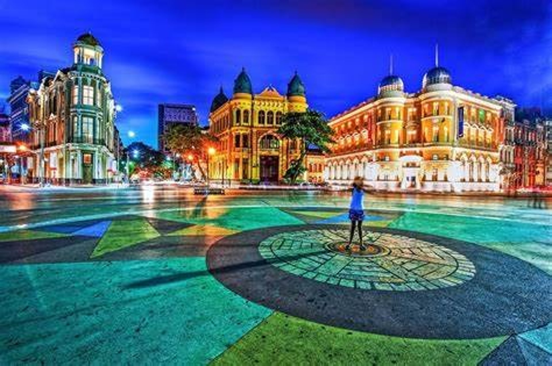 a group of people swimming in a body of water with palm trees