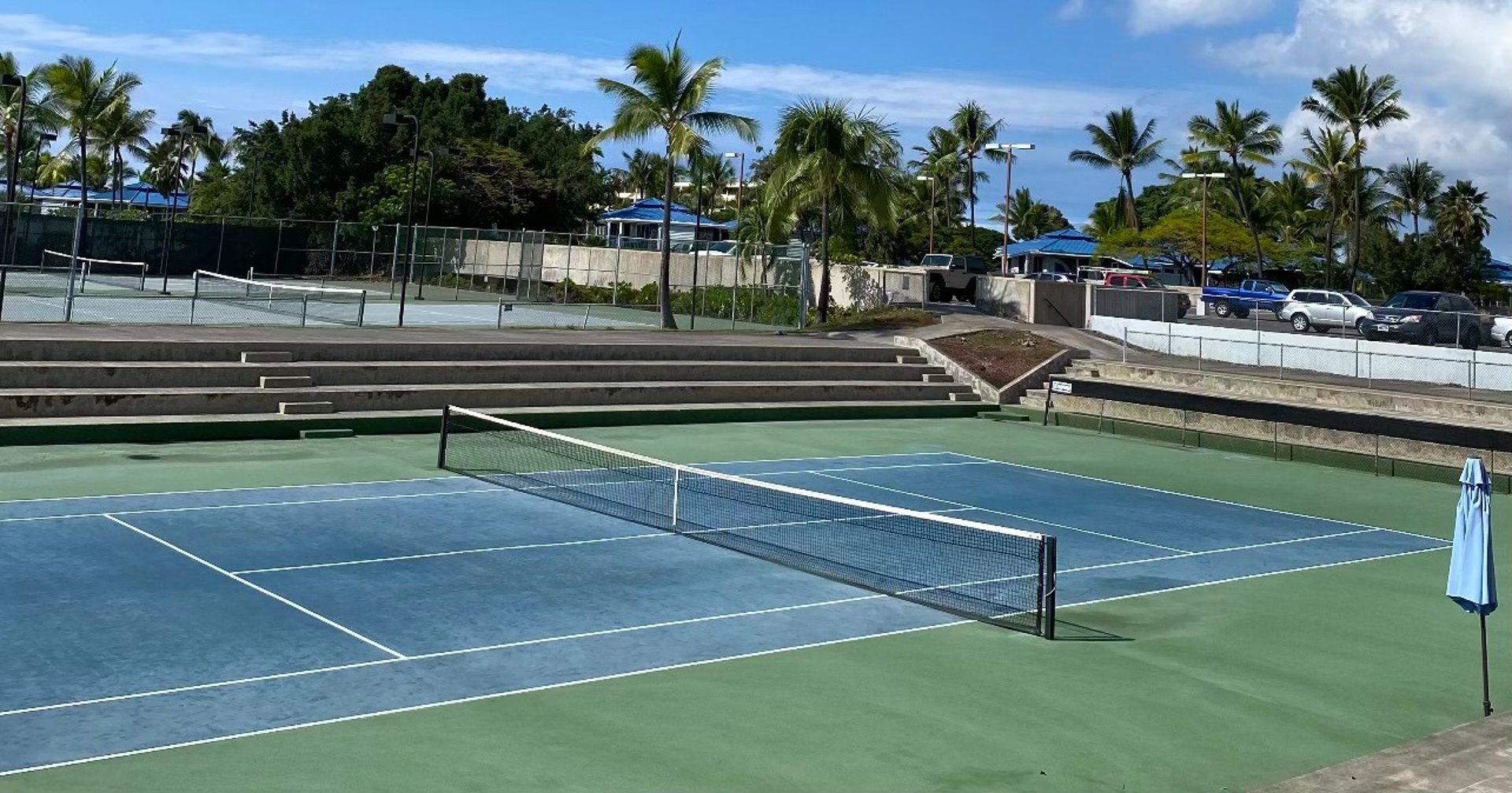 a person holding a tennis ball and a racket
