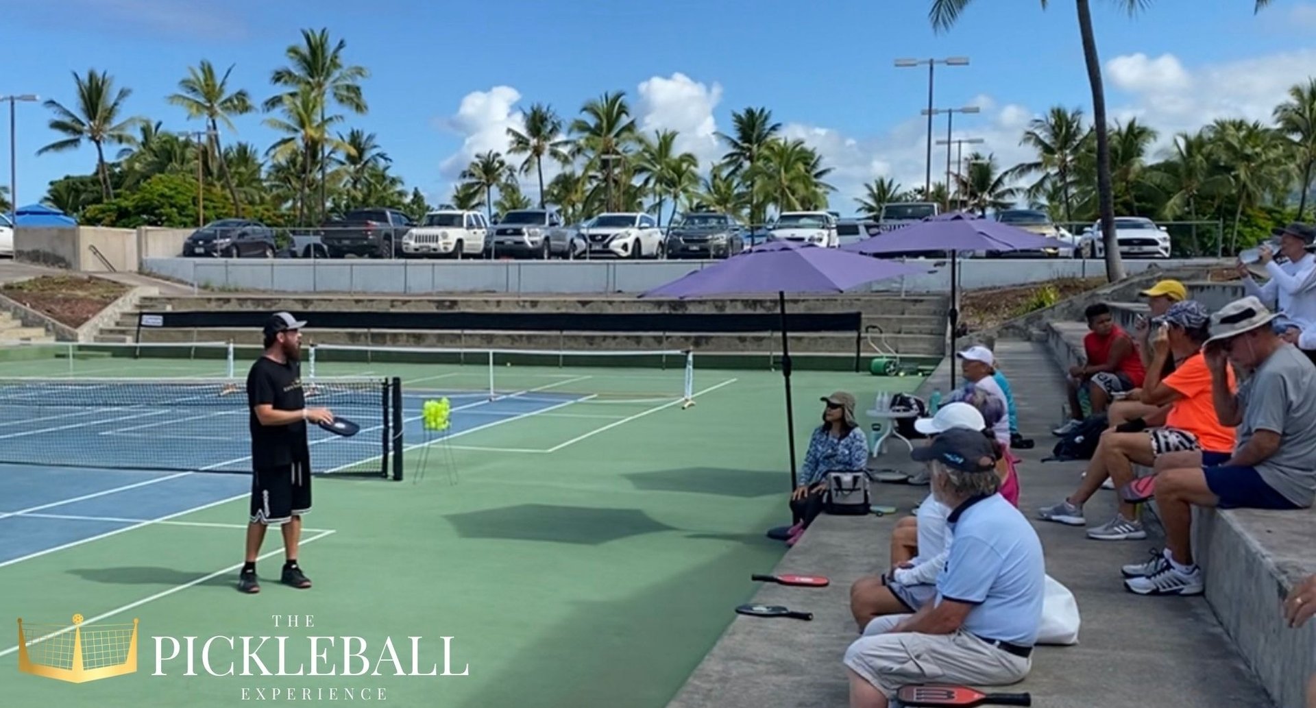 a person holding a tennis ball and a racket