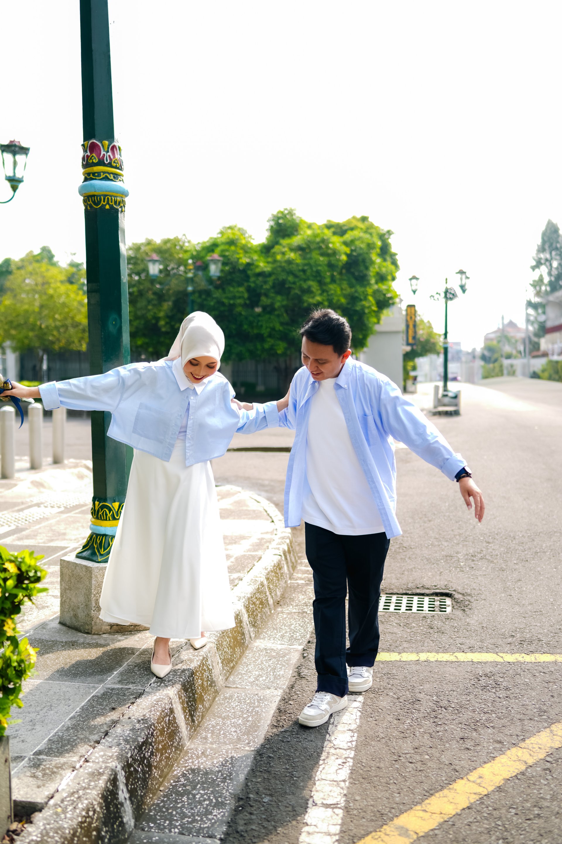 an abstract photo of a curved building with a blue sky in the background