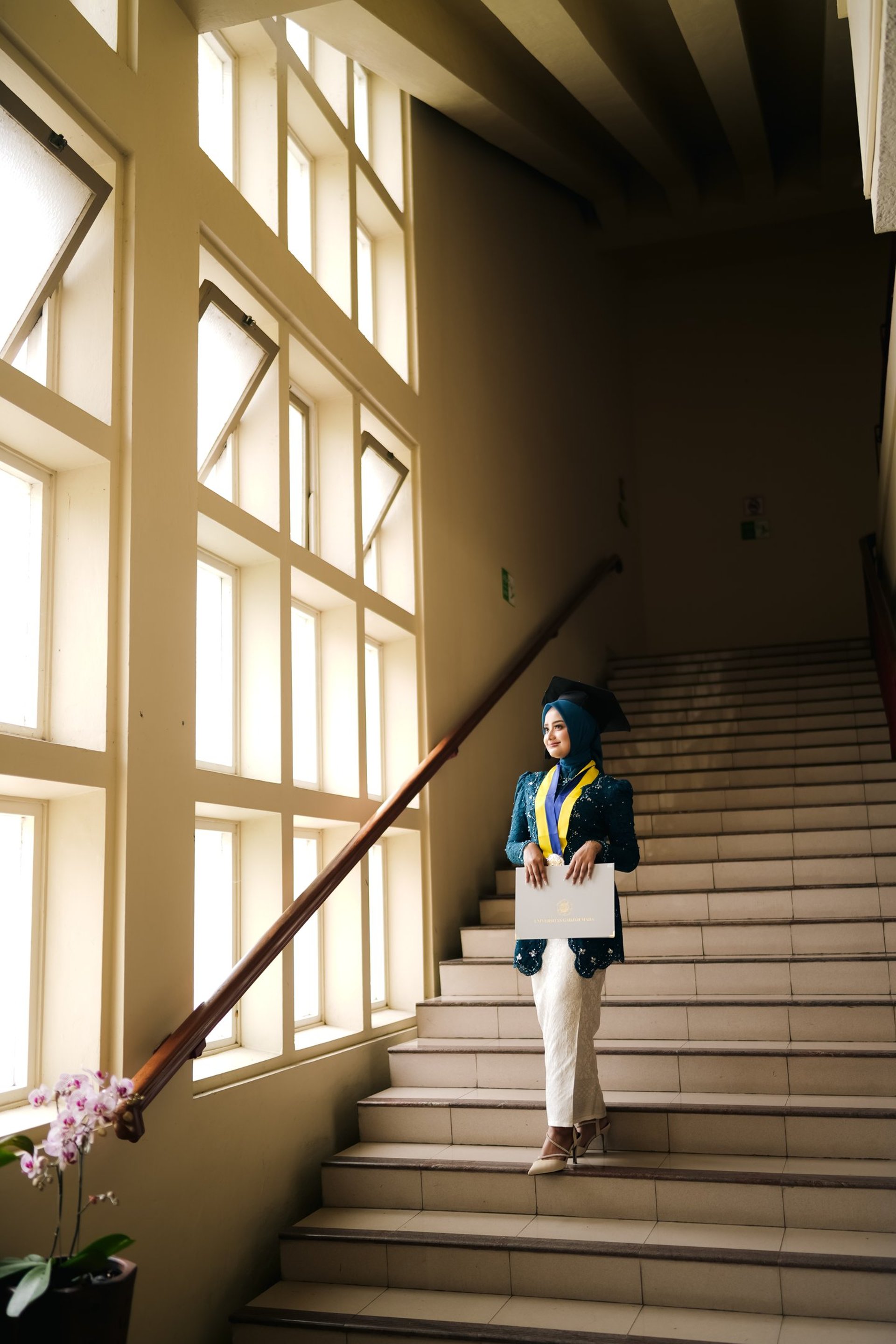 an abstract photo of a curved building with a blue sky in the background