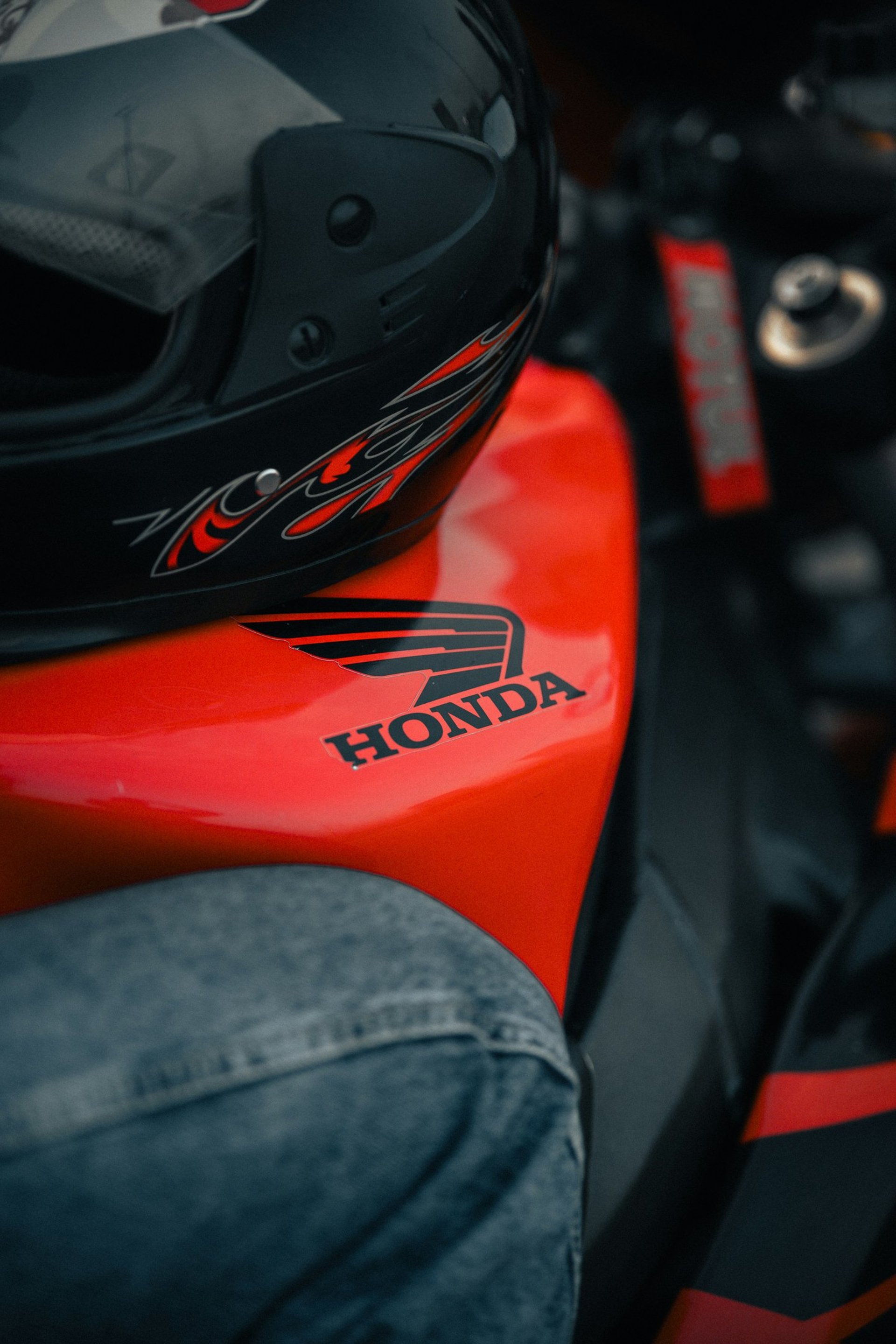 black honda motorcycle on brown floor