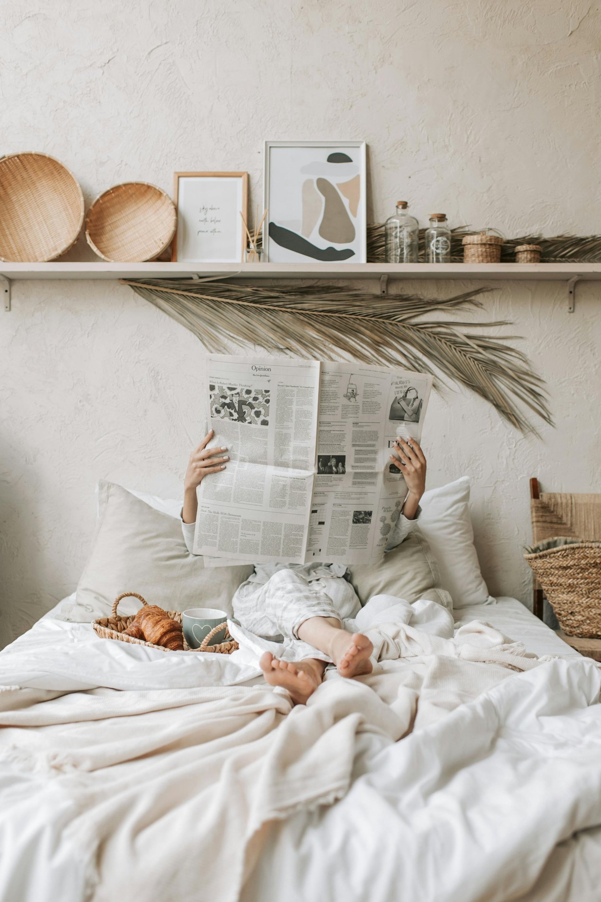 white bed with gray and white bed linen