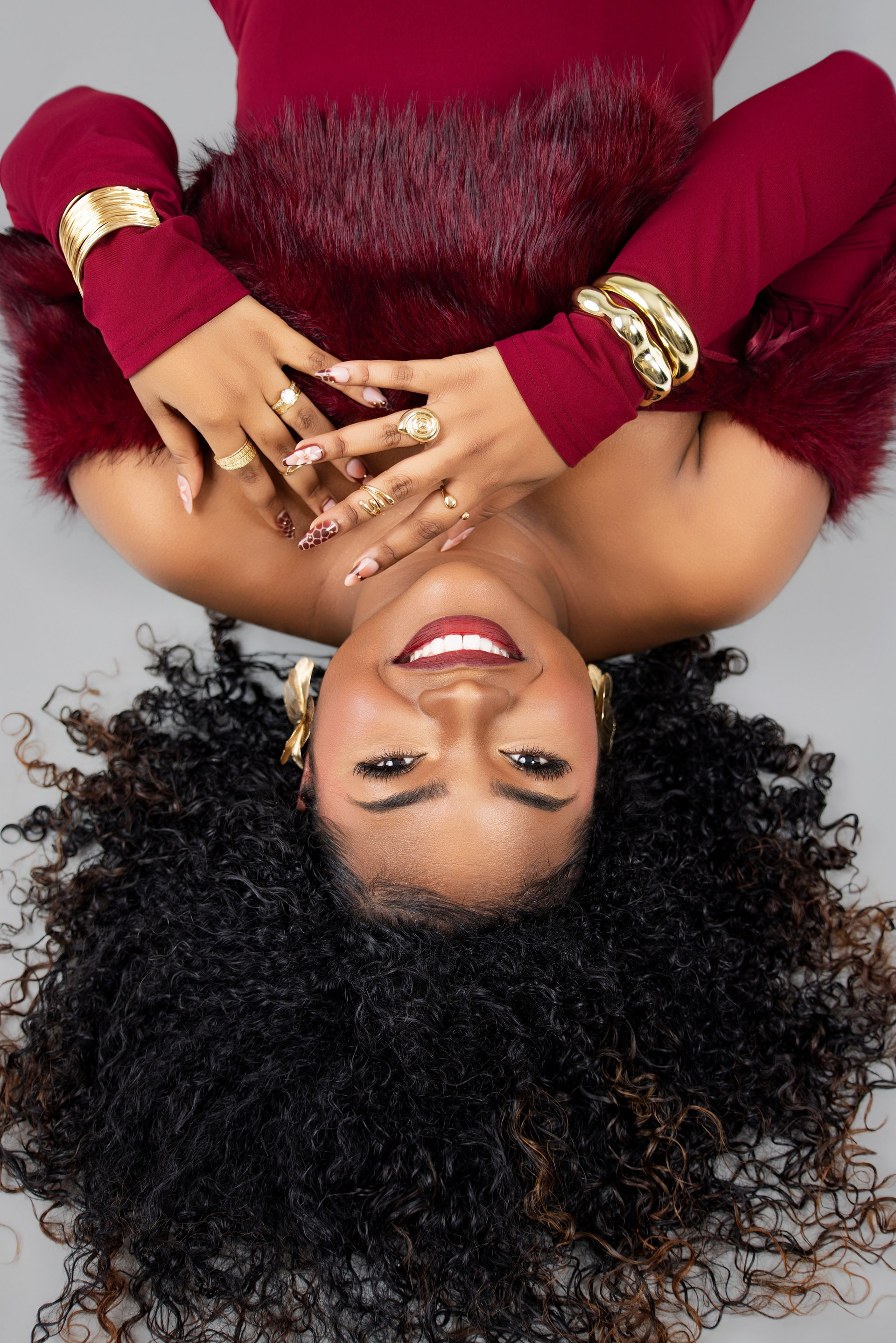 woman wearing gold-colored and silver-colored rings