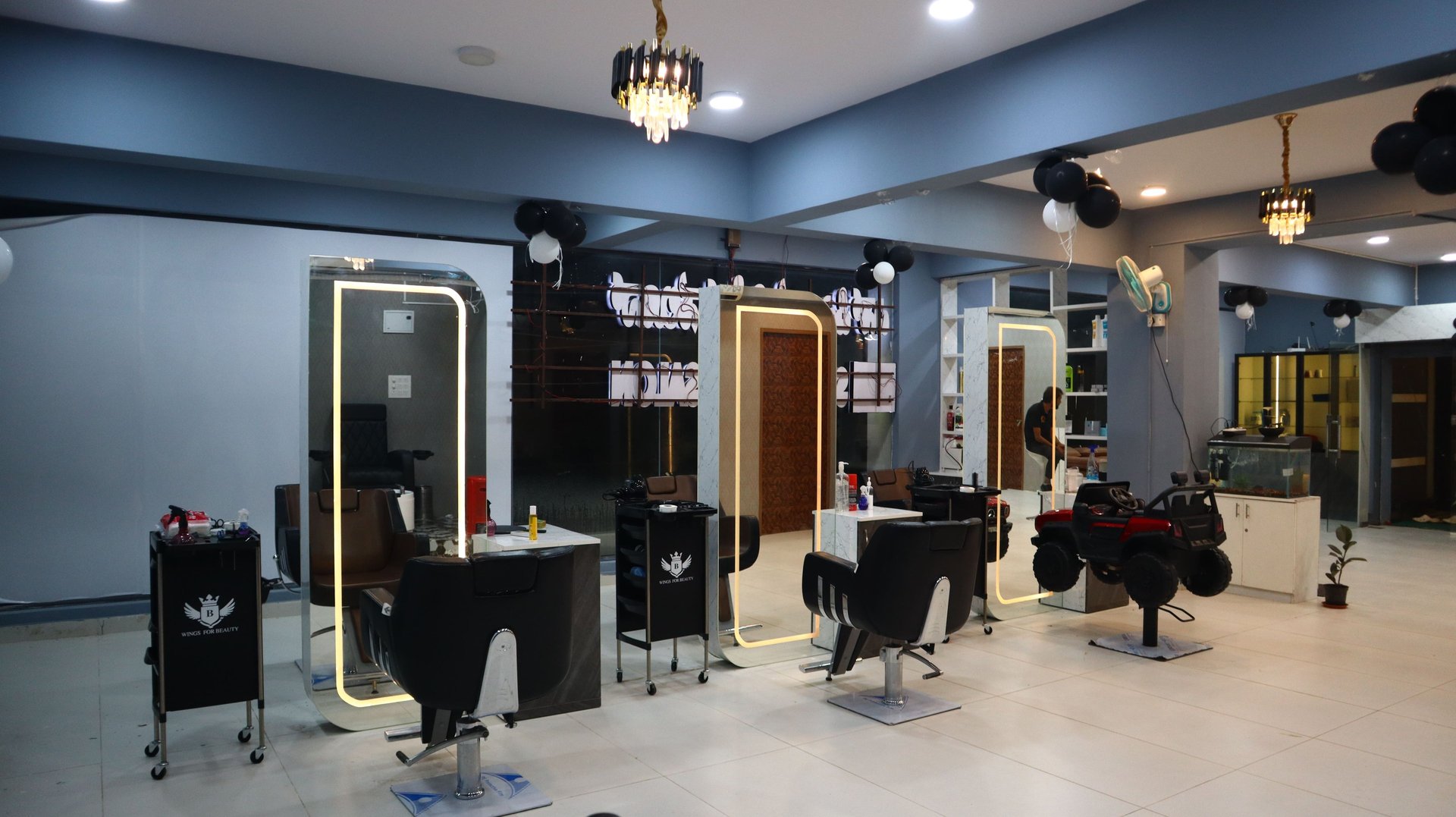 woman in gray sweater sitting on brown wooden chair