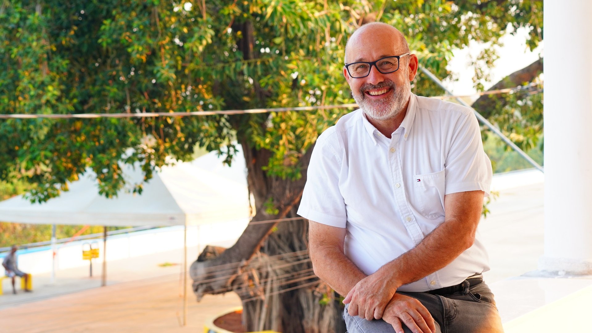 an abstract photo of a curved building with a blue sky in the background