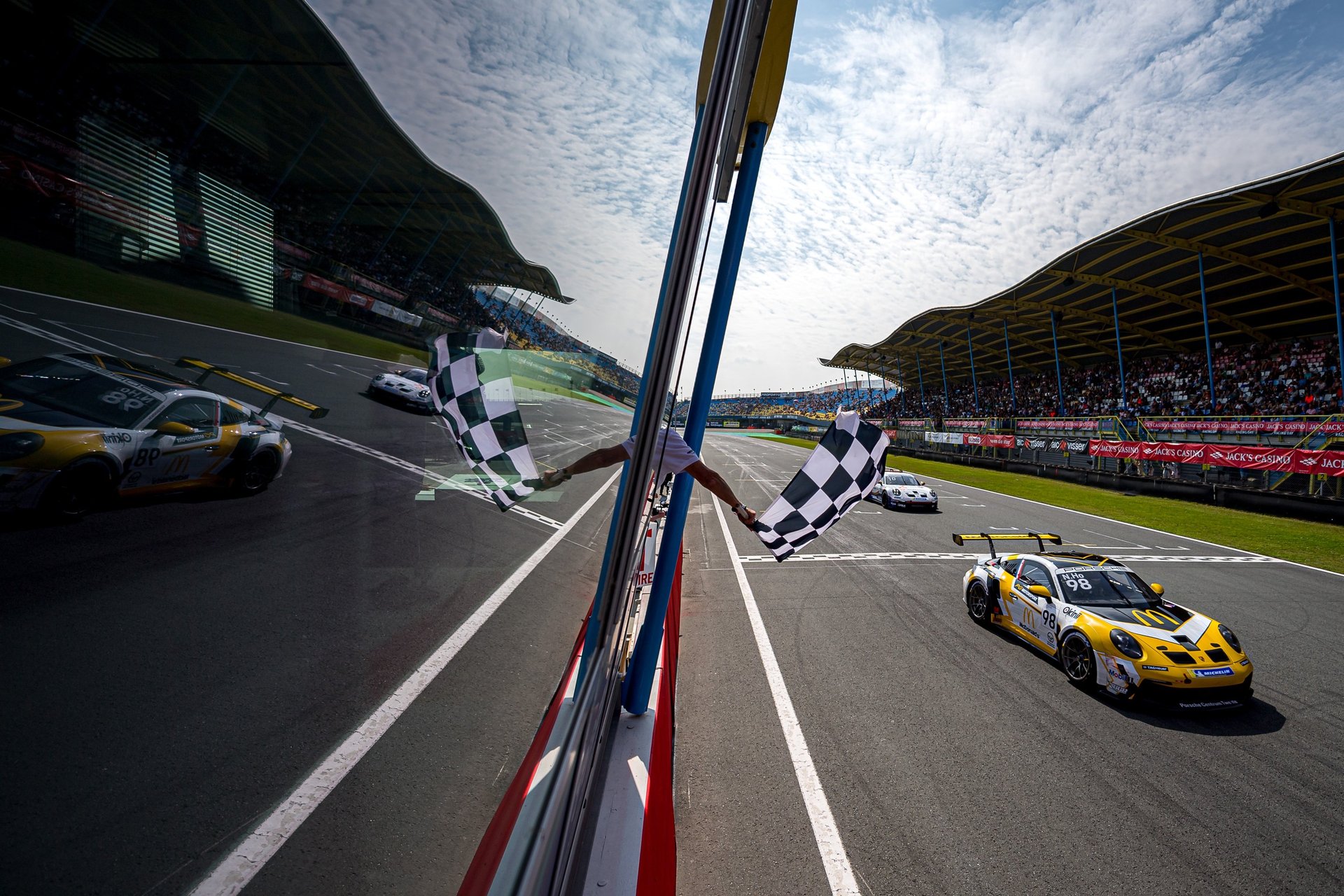 an abstract photo of a curved building with a blue sky in the background