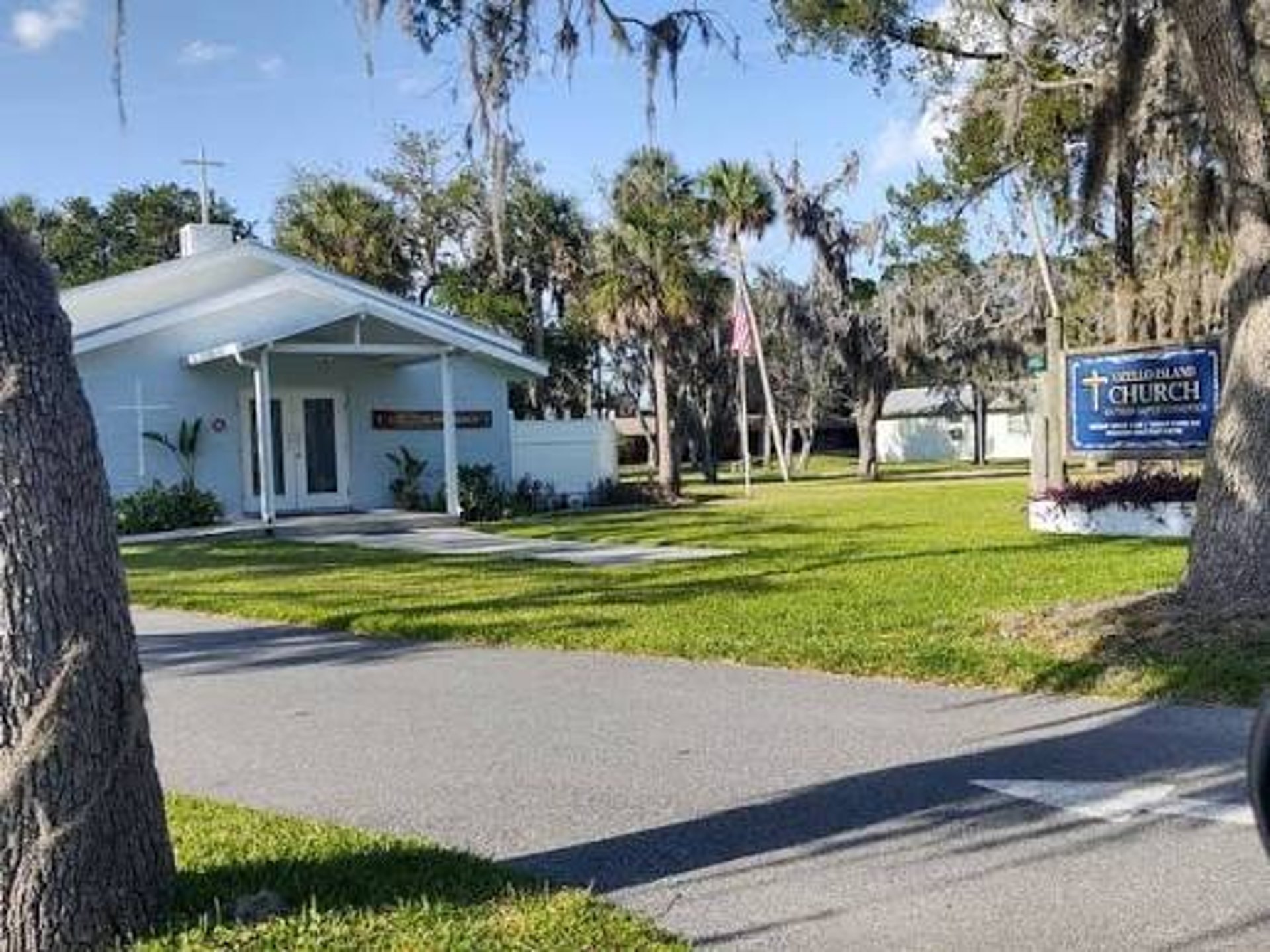 woman wearing yellow long-sleeved dress under white clouds and blue sky during daytime
