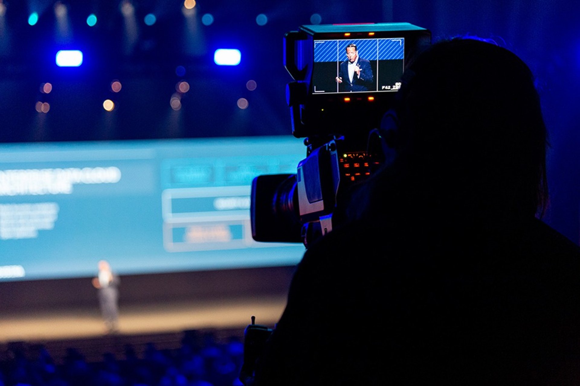 an abstract photo of a curved building with a blue sky in the background
