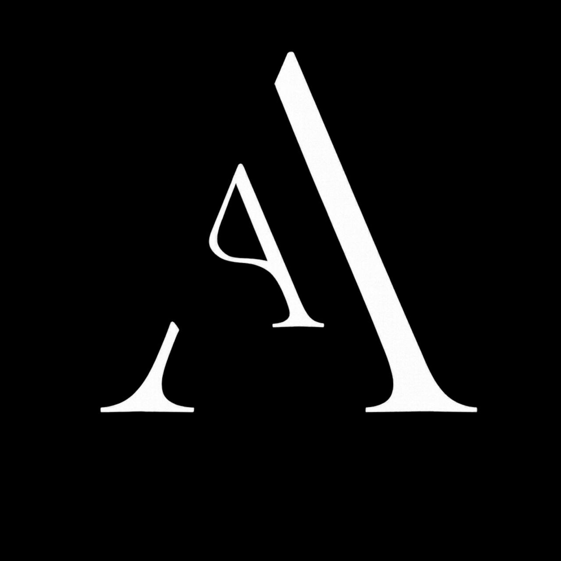 black and brown leather padded tub sofa