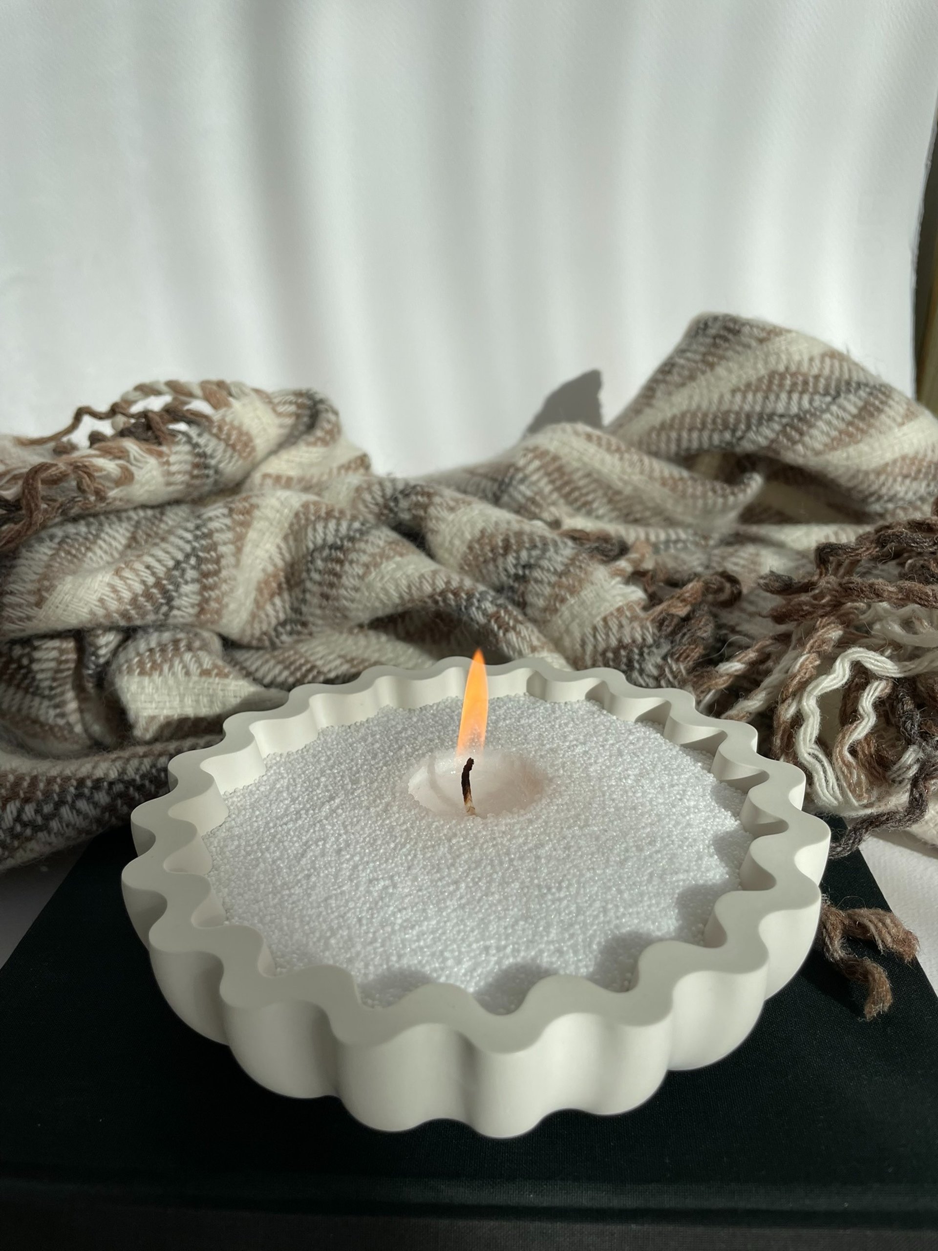 an abstract photo of a curved building with a blue sky in the background