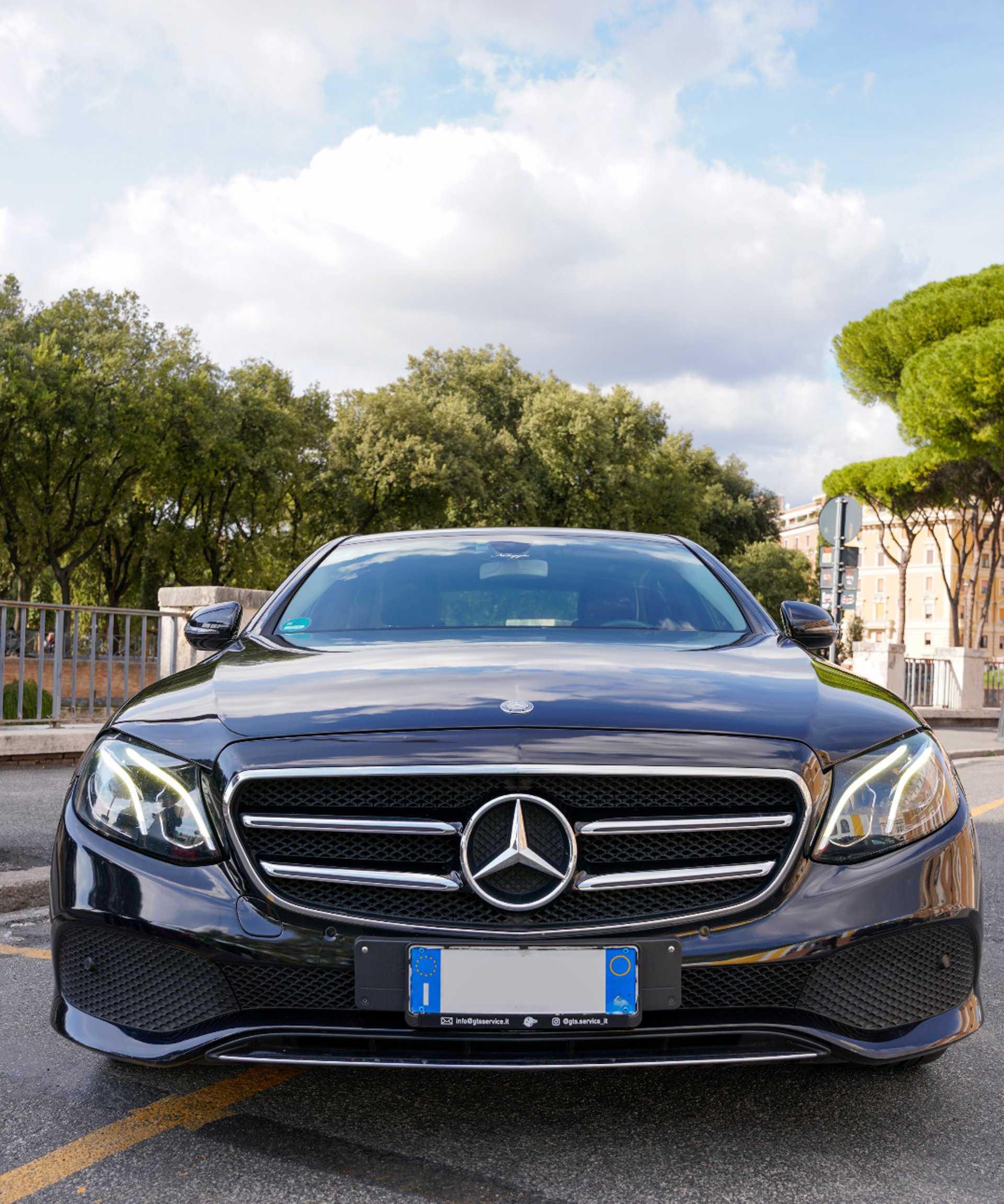 black mercedes benz c class on road during daytime