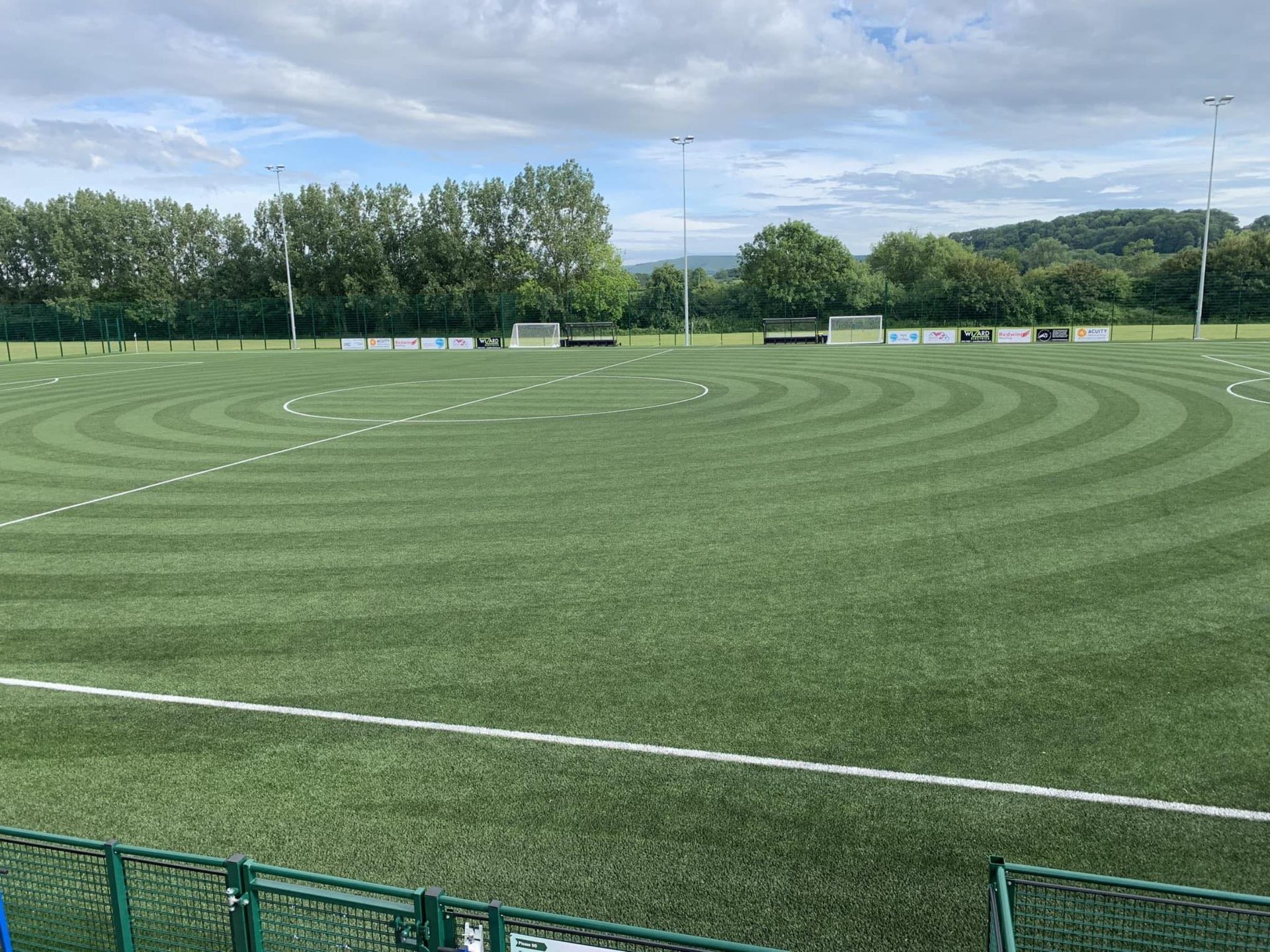 a close up of a soccer shoe on a field