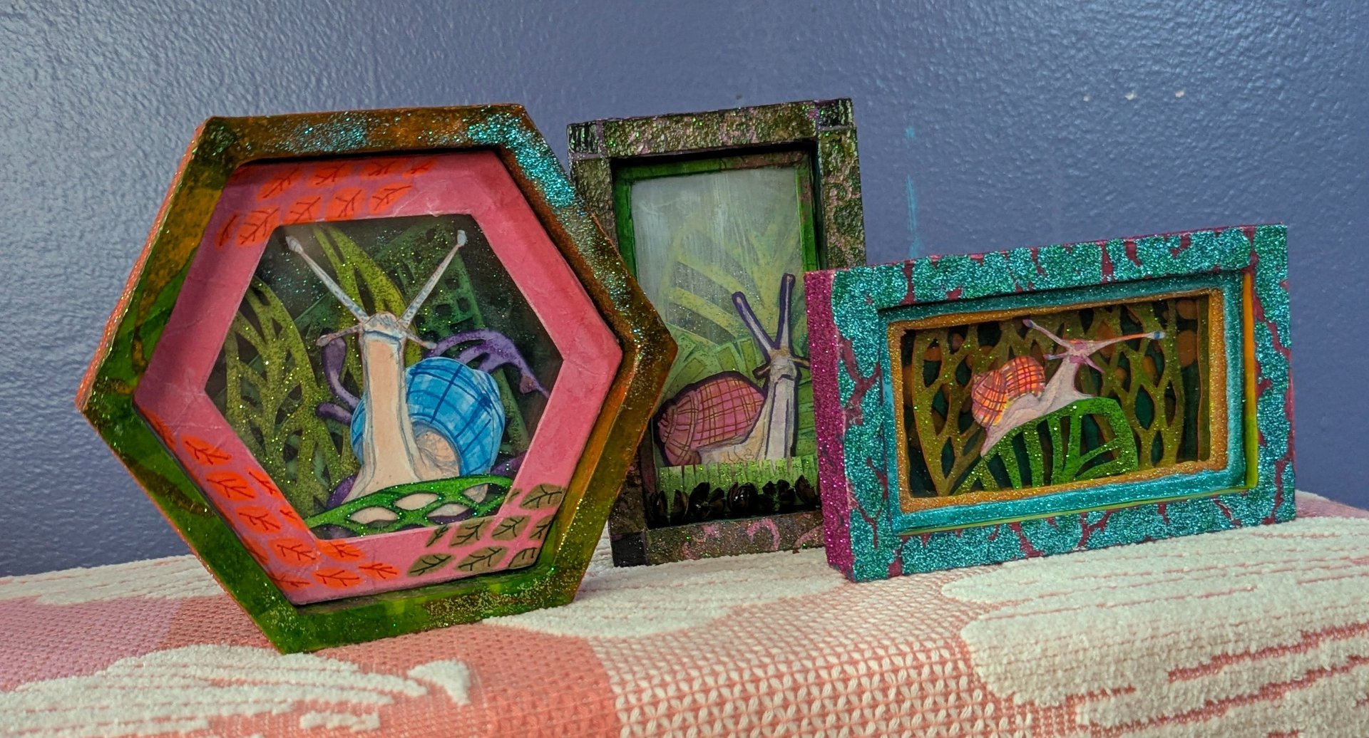 Diorama boxes containing Snails in Plaid by Kathy LaFollett
