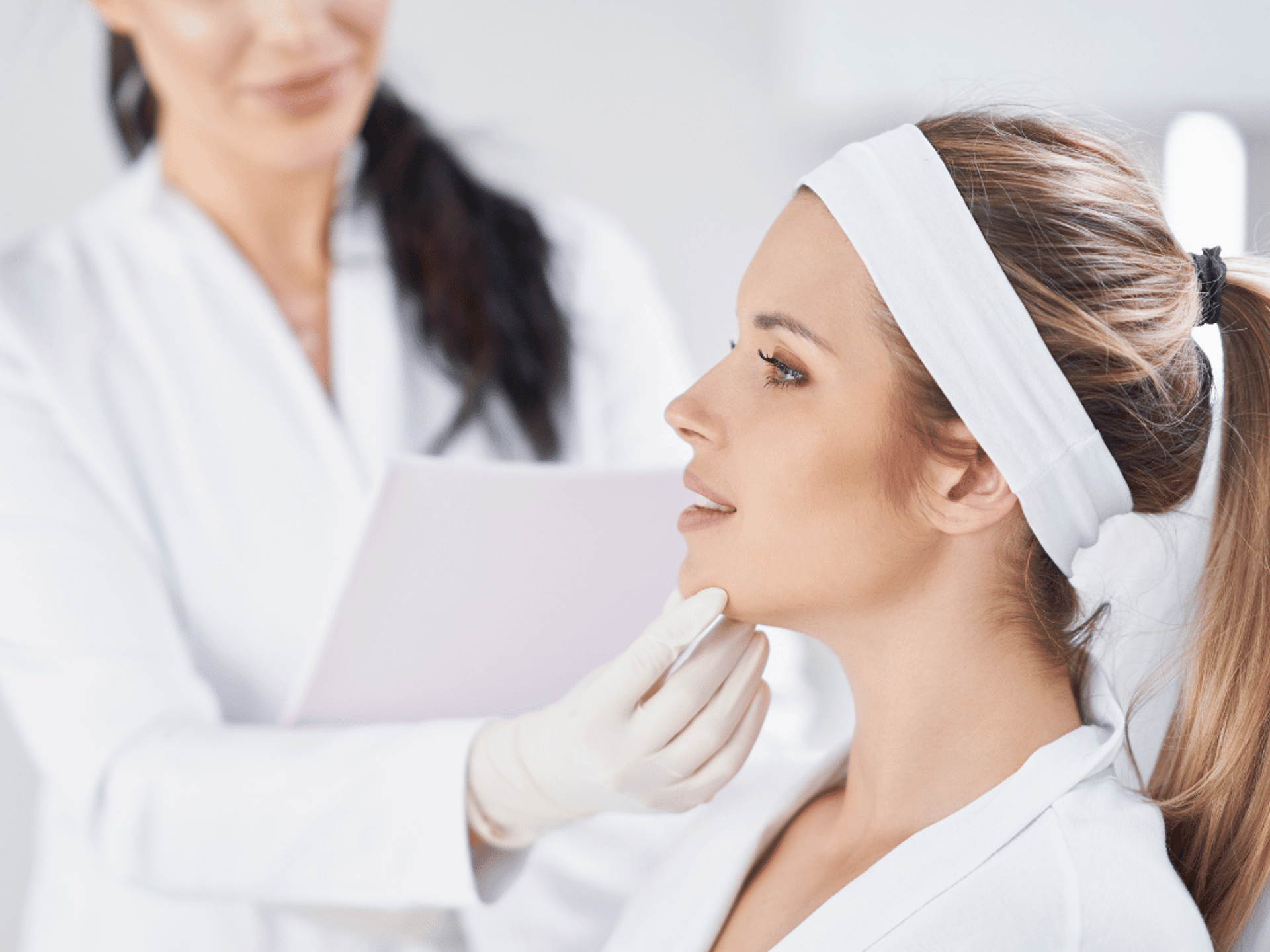 an abstract photo of a curved building with a blue sky in the background