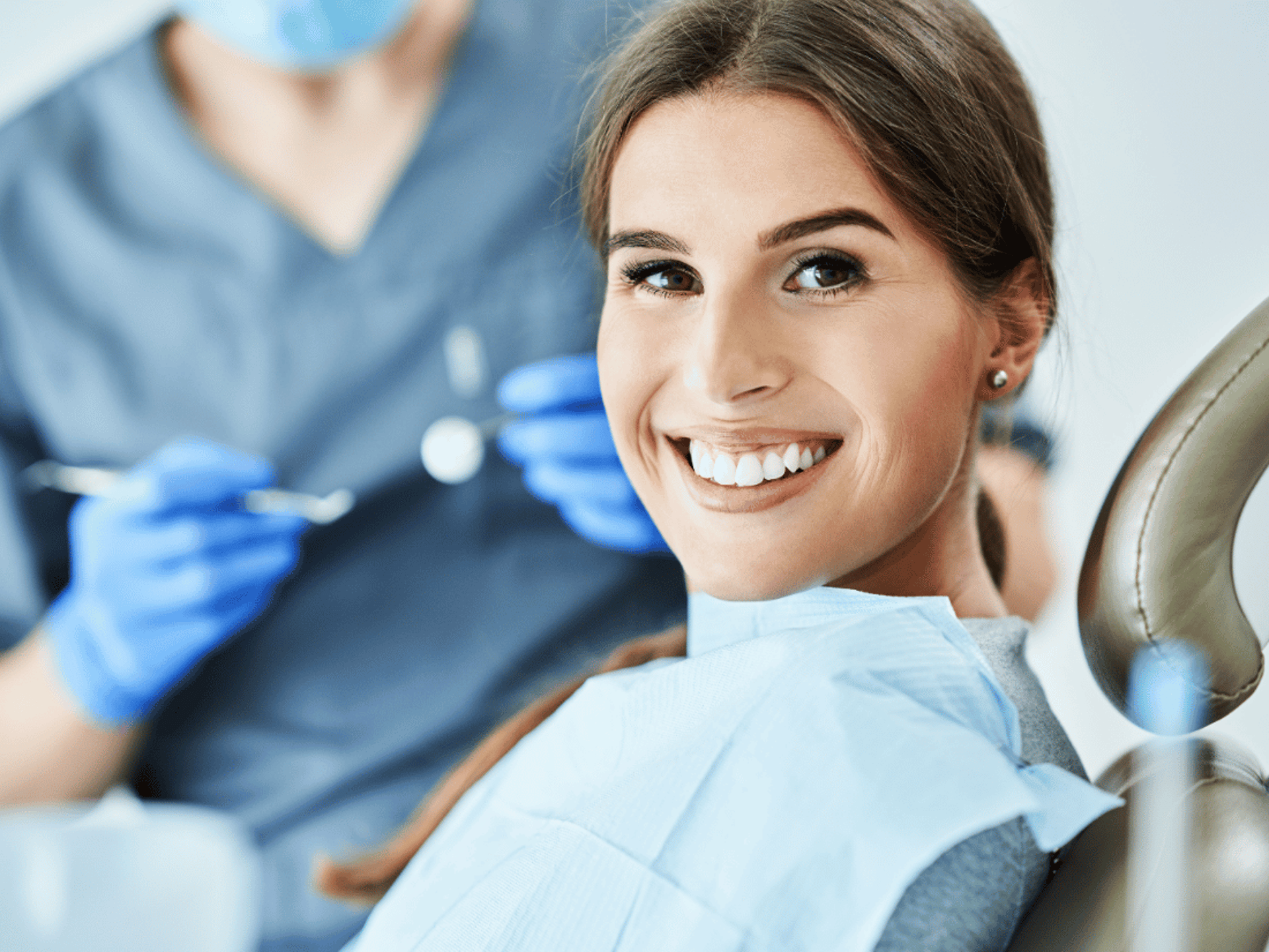 an abstract photo of a curved building with a blue sky in the background