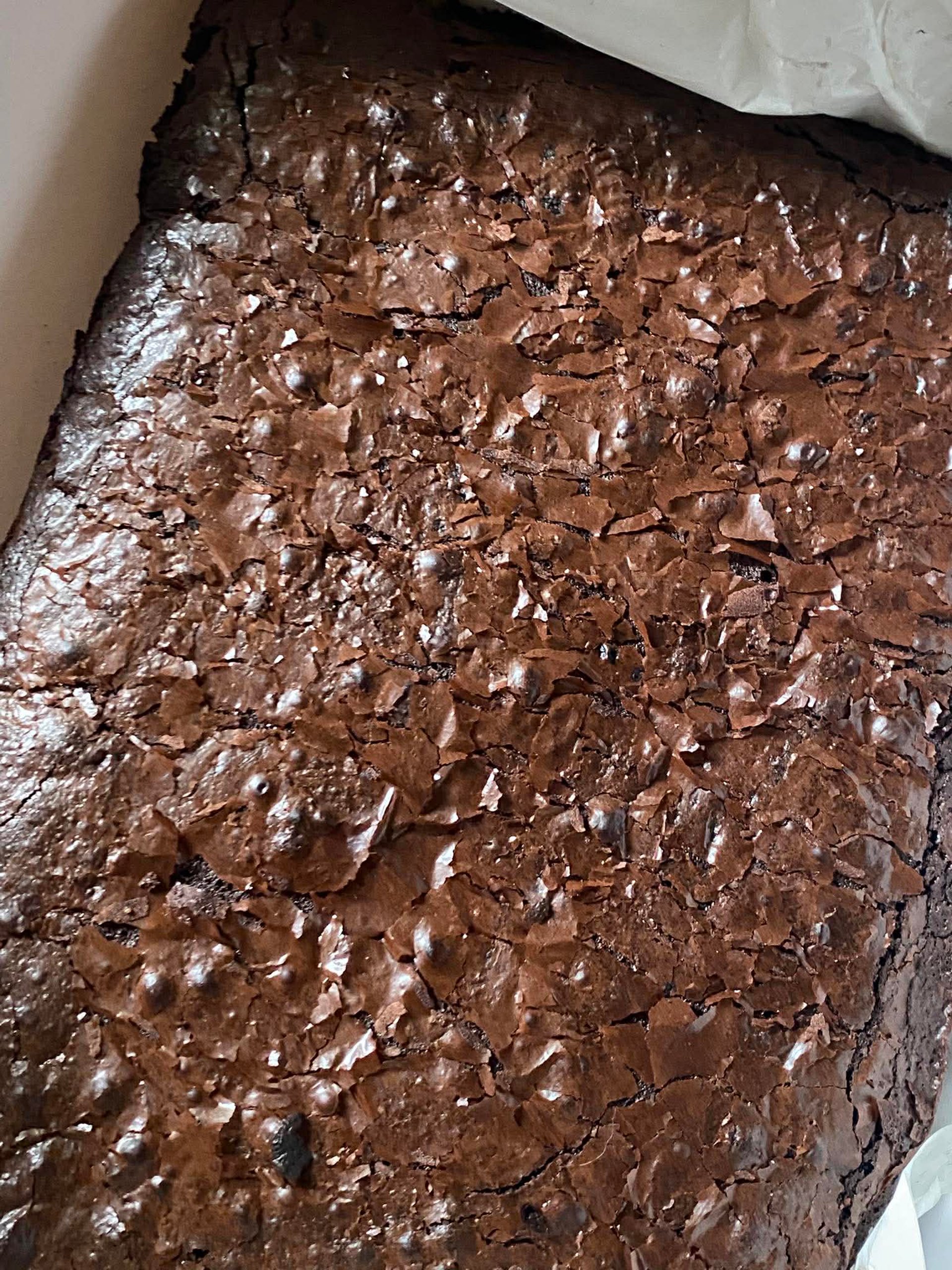 an abstract photo of a curved building with a blue sky in the background