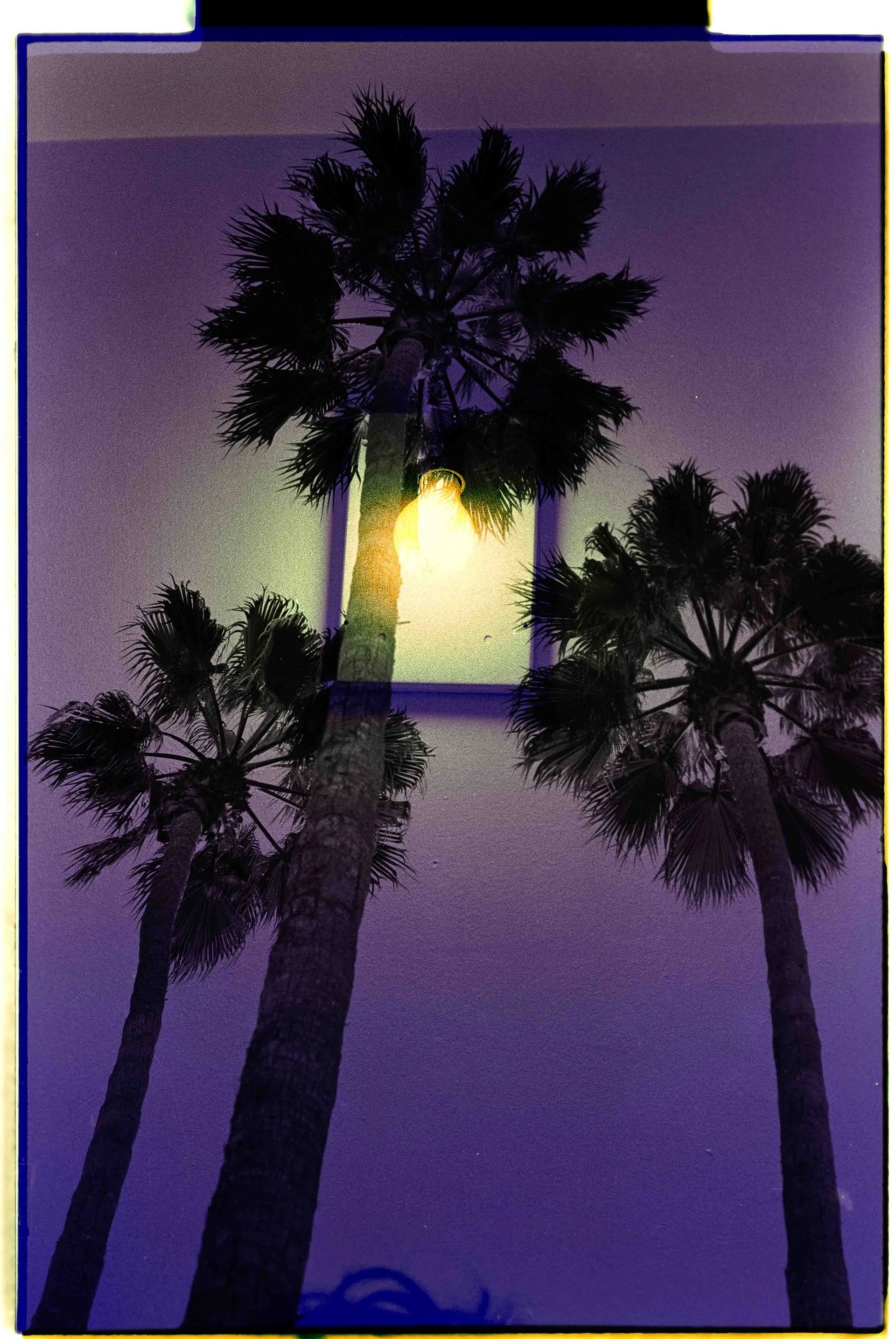 an abstract photo of a curved building with a blue sky in the background