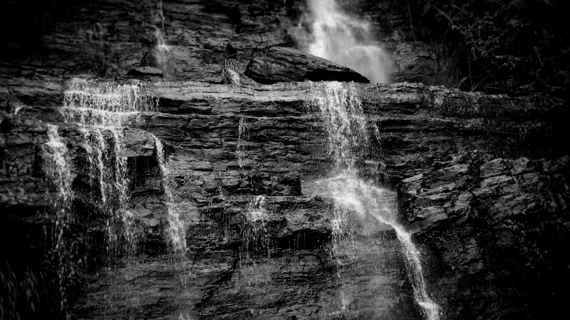 a red cloud of smoke on a black background