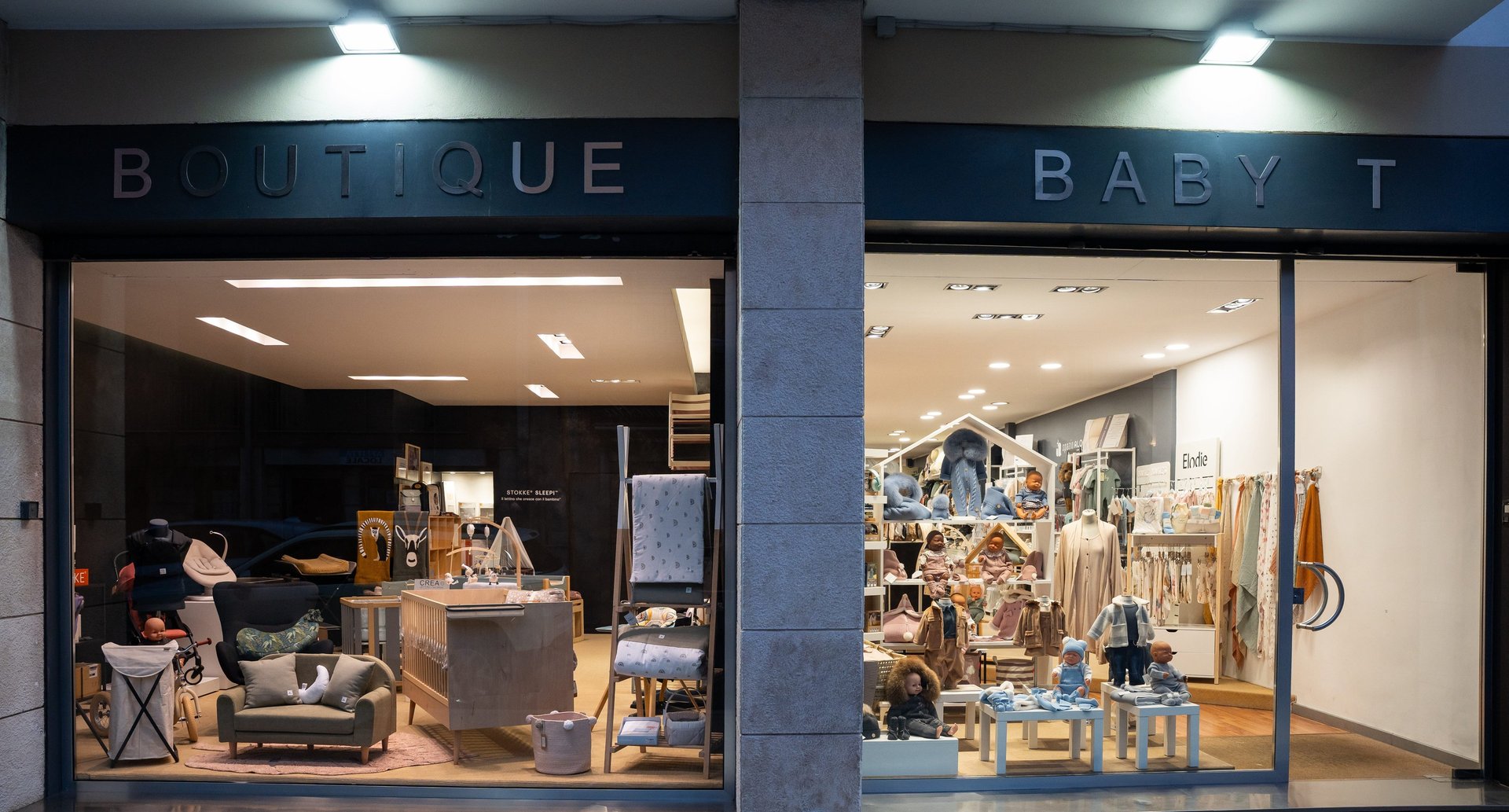 grayscale photography of two girls closing their mouths