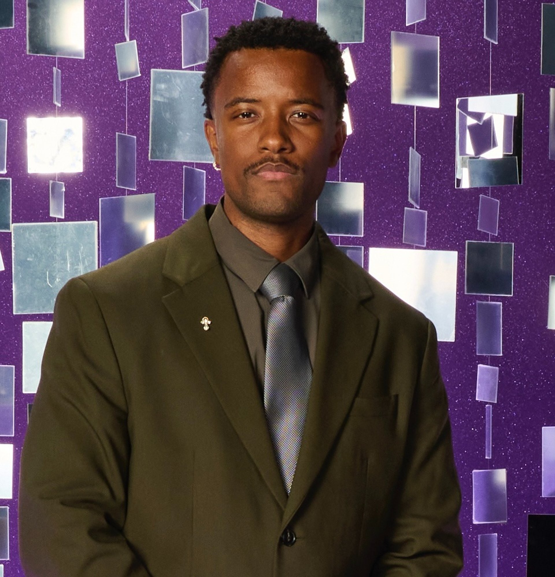 an abstract photo of a curved building with a blue sky in the background