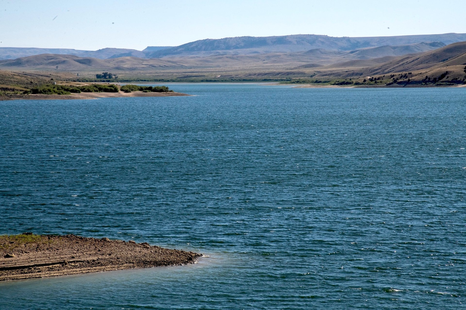 person holding black string during sunset