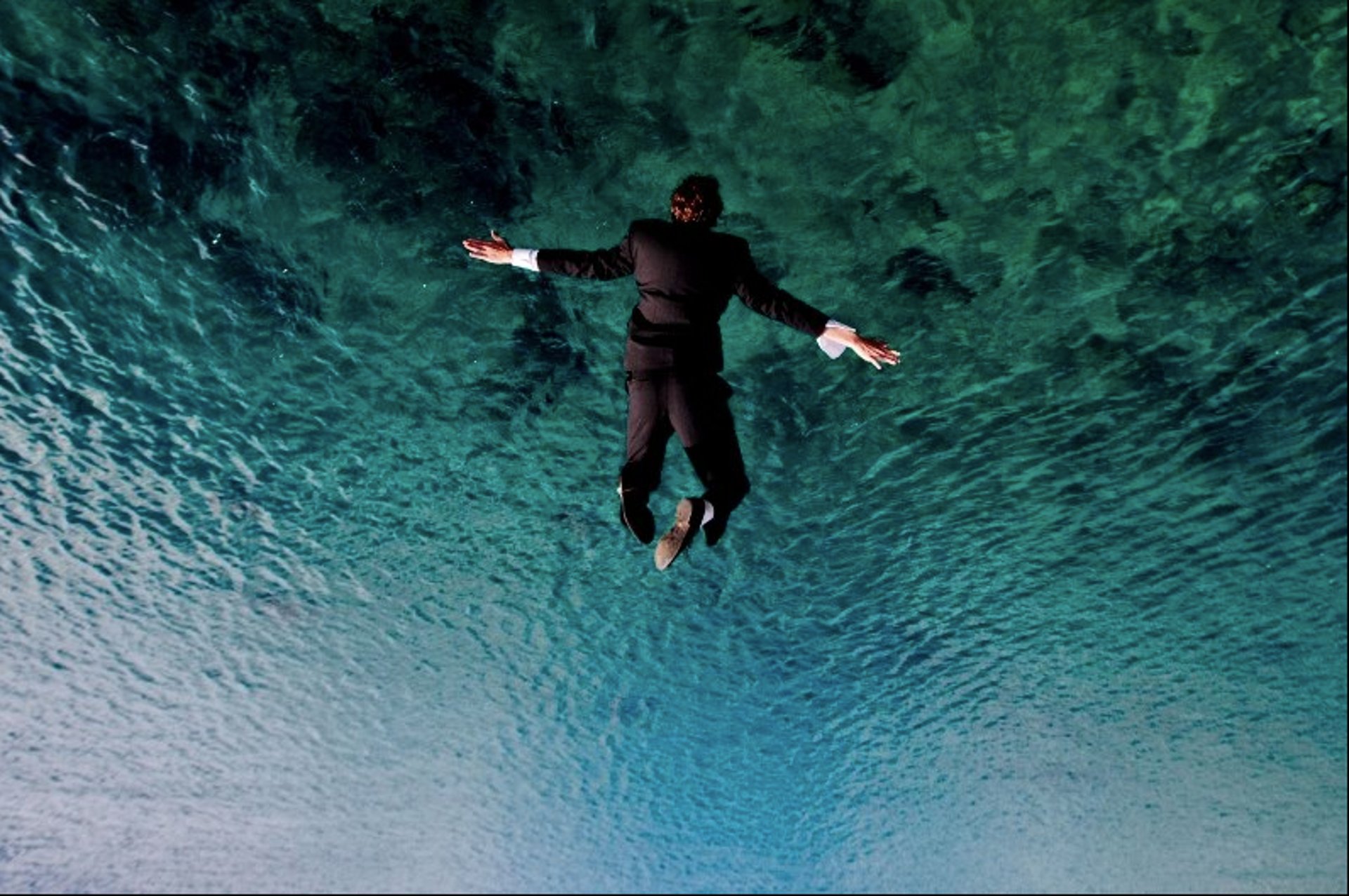 woman wearing yellow long-sleeved dress under white clouds and blue sky during daytime
