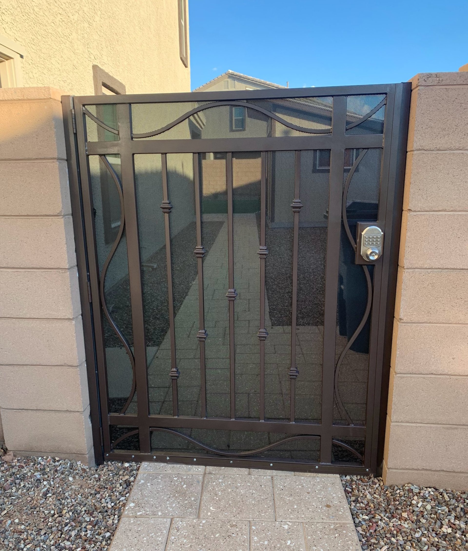 A backyard with a deck and a fence