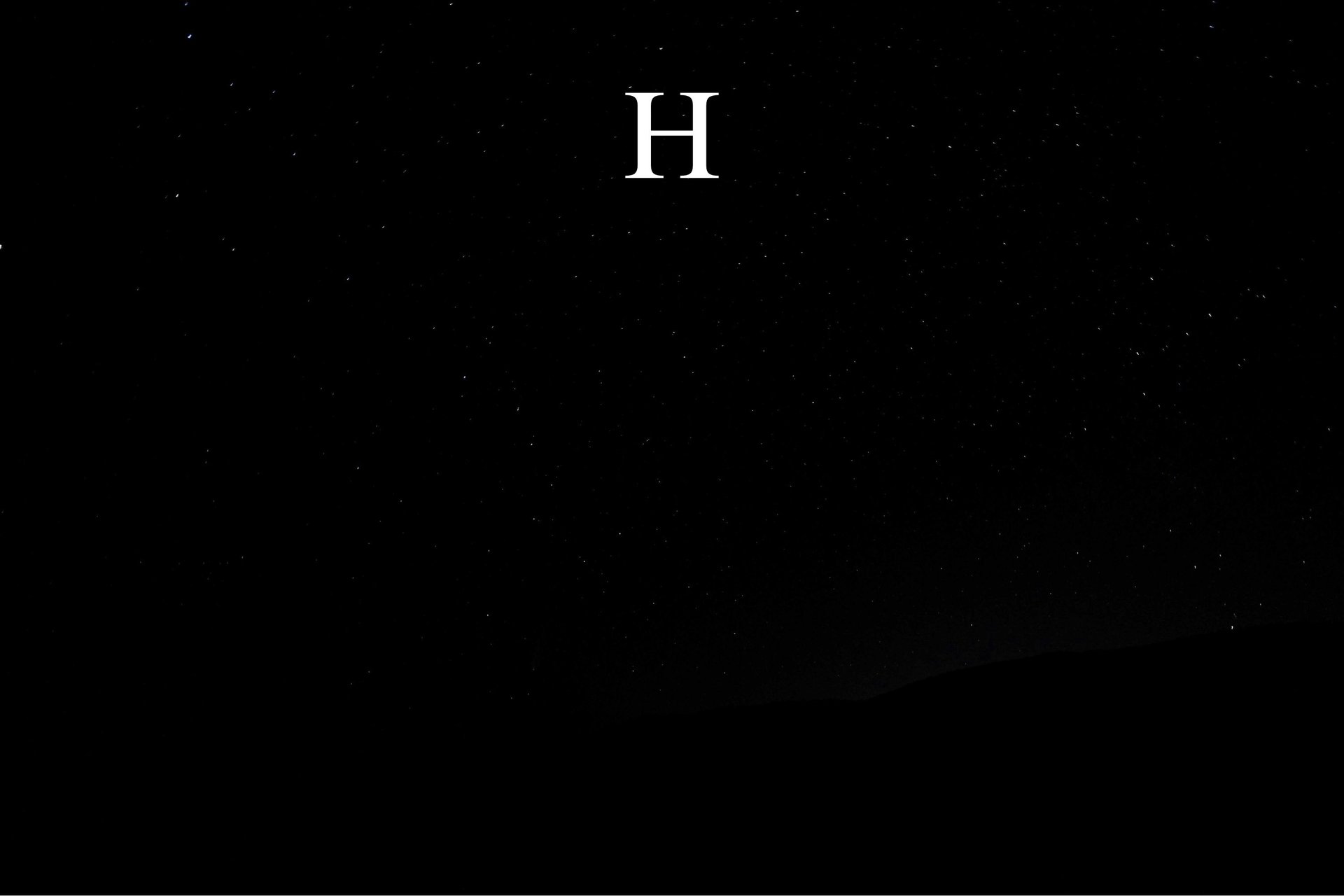 a close up of a black and brown abstract painting