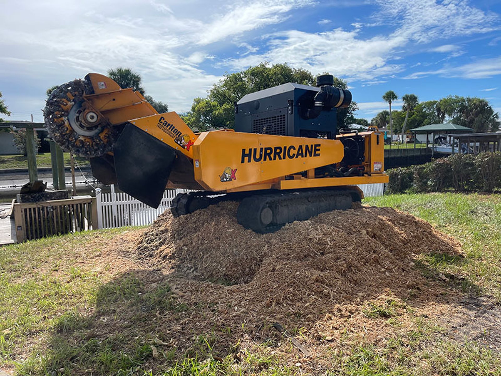 yellow and black front loader on forest during daytime