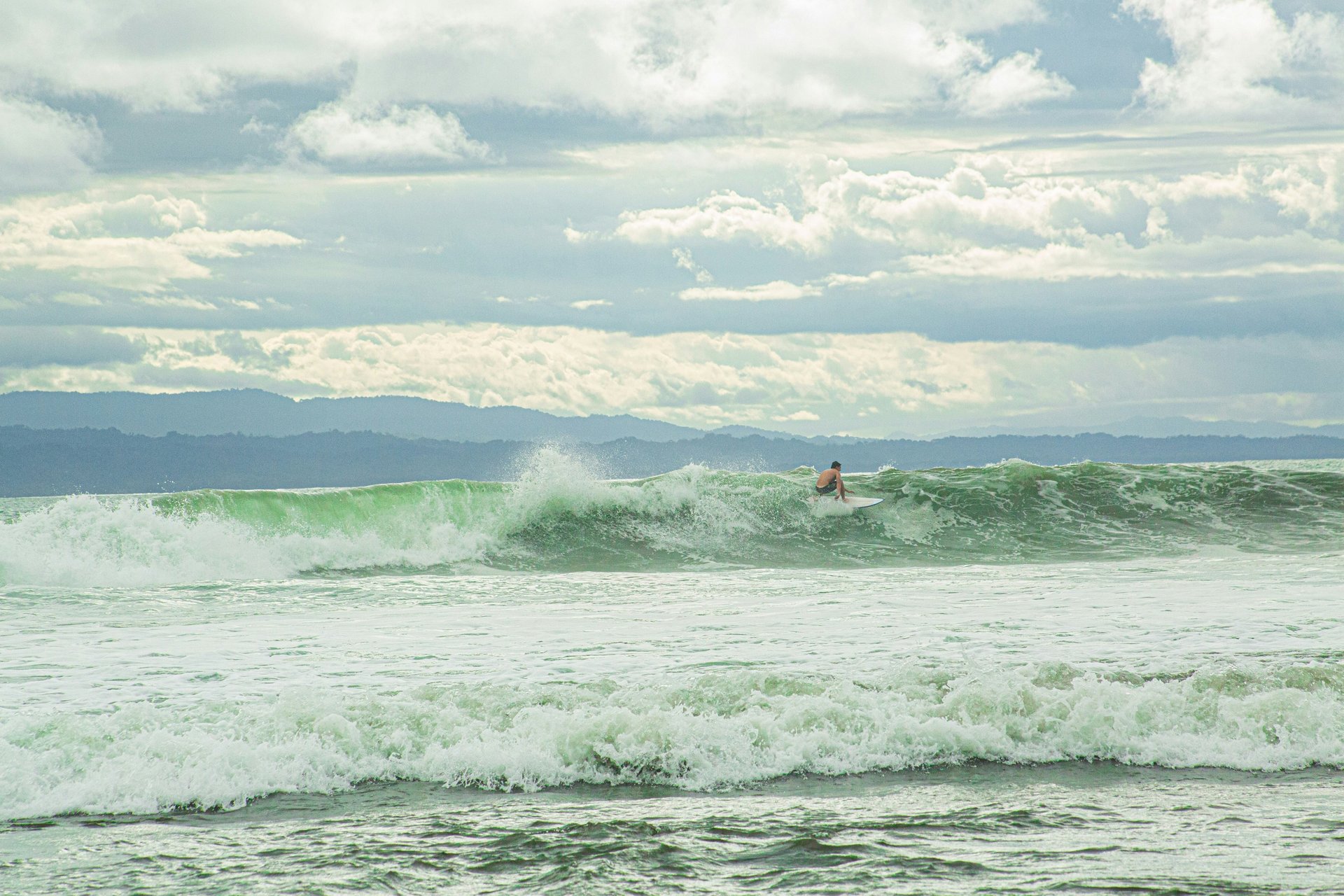 person surfing on body of water
