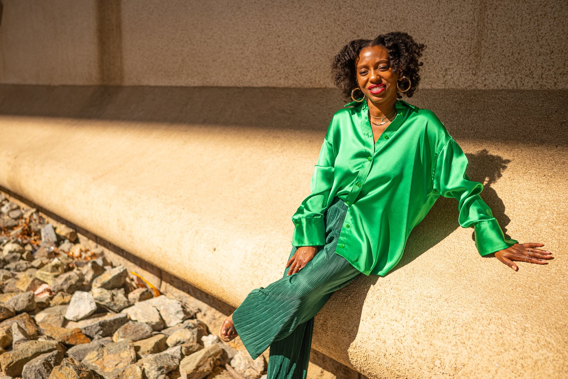 an abstract photo of a curved building with a blue sky in the background