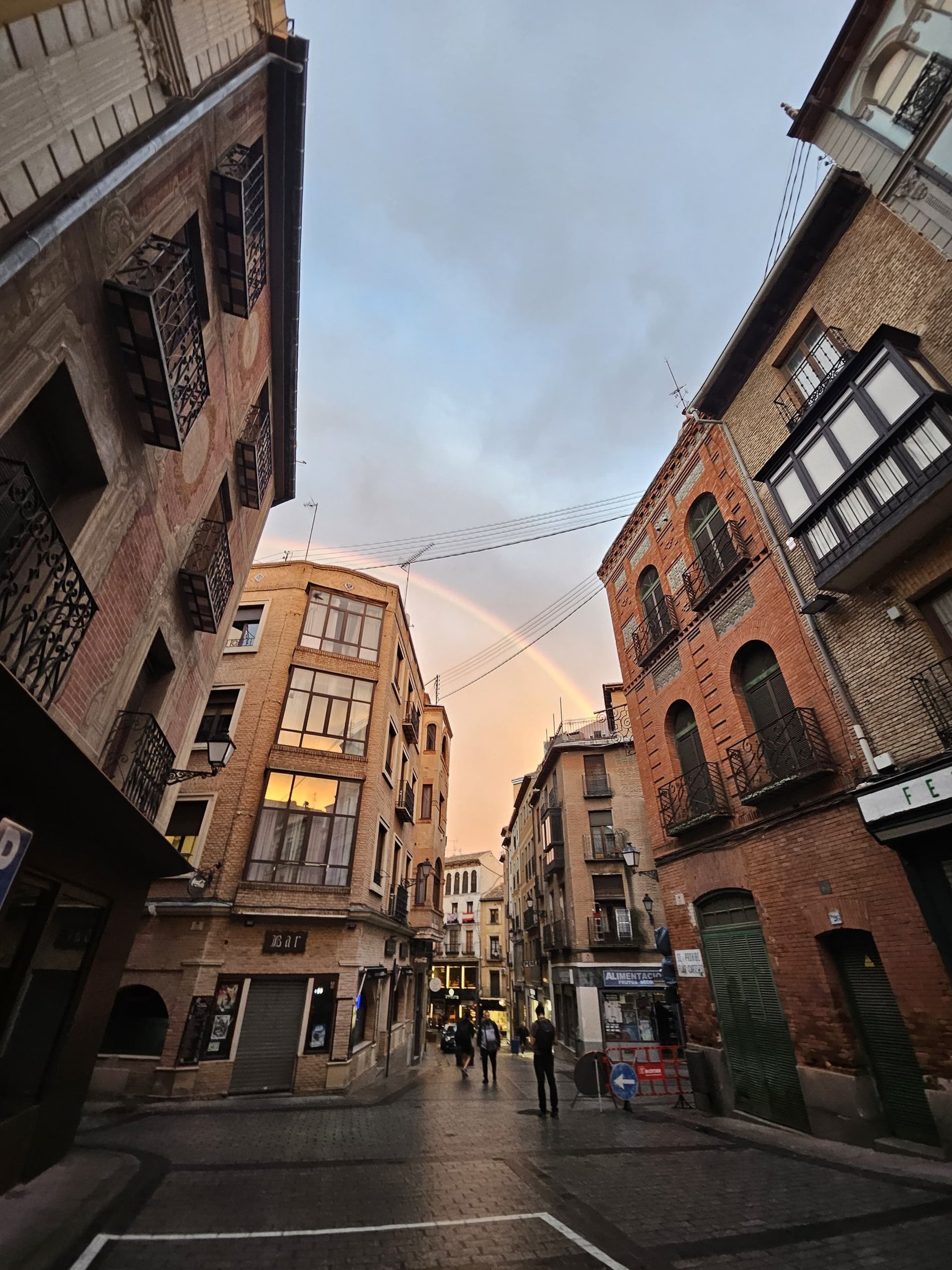 an abstract photo of a curved building with a blue sky in the background